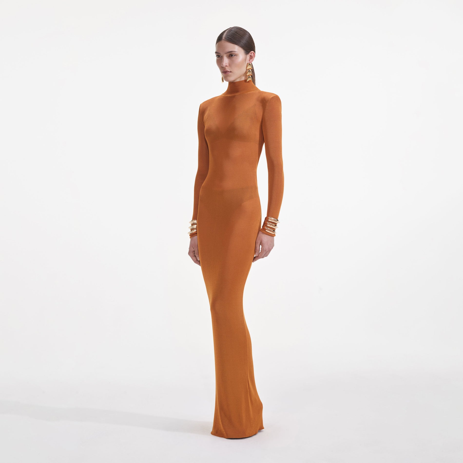 Side view of a woman wearing the Tan Viscose Knit Maxi Dress