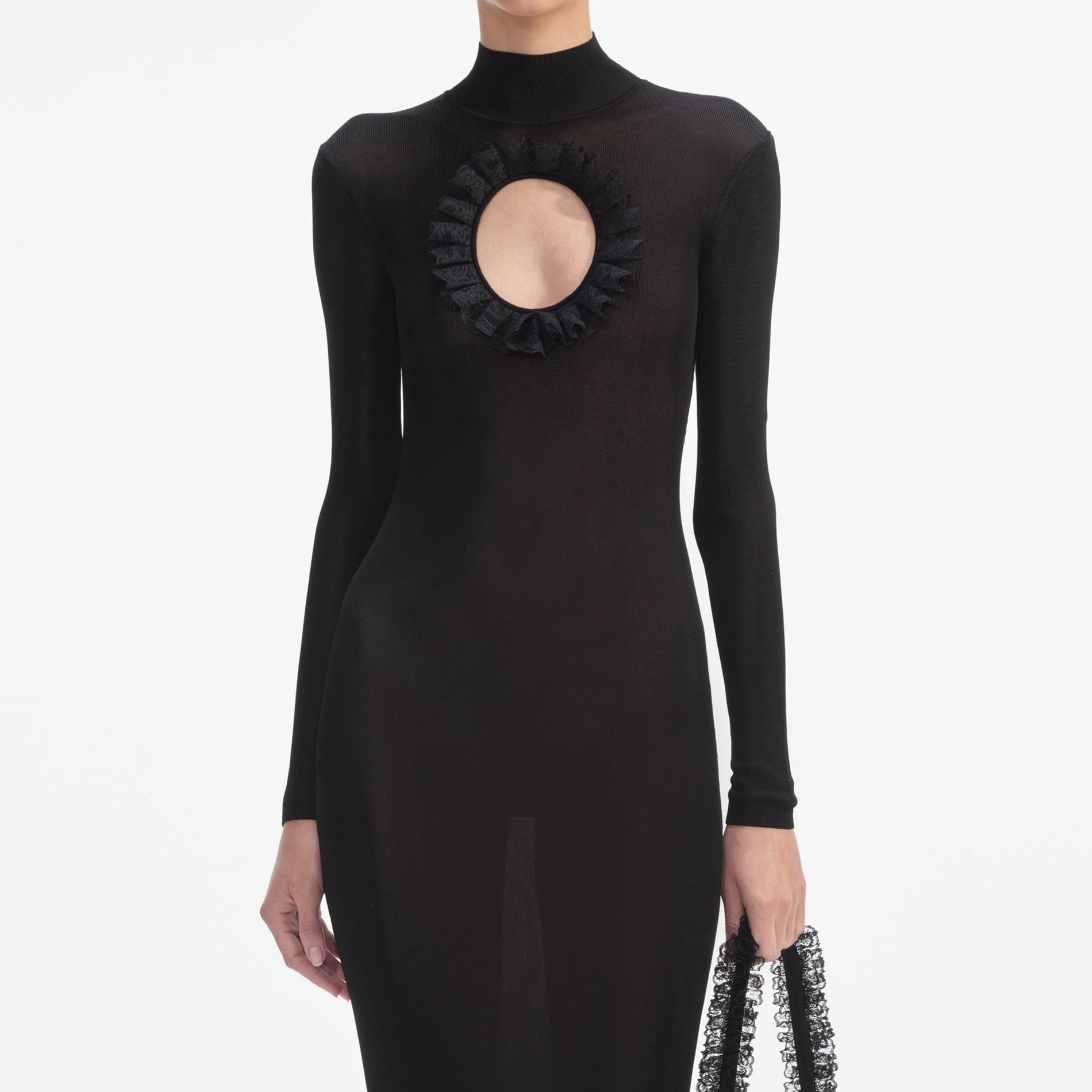 A close up of a woman wearing the Black Knit Cut Out Maxi Dress