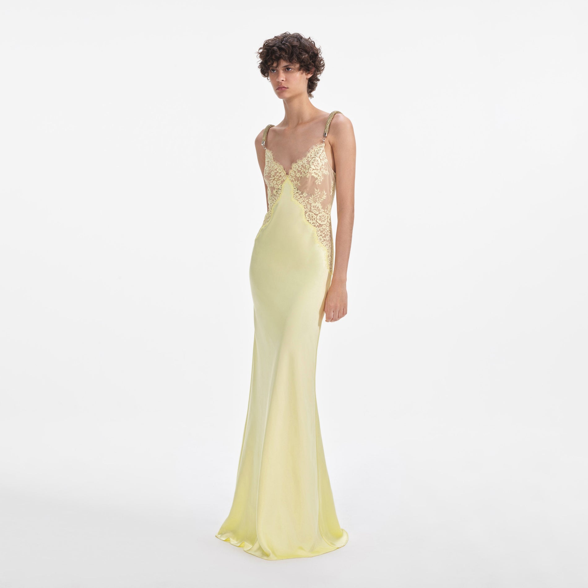 Side view of a woman wearing the Yellow Lace Satin Maxi Dress