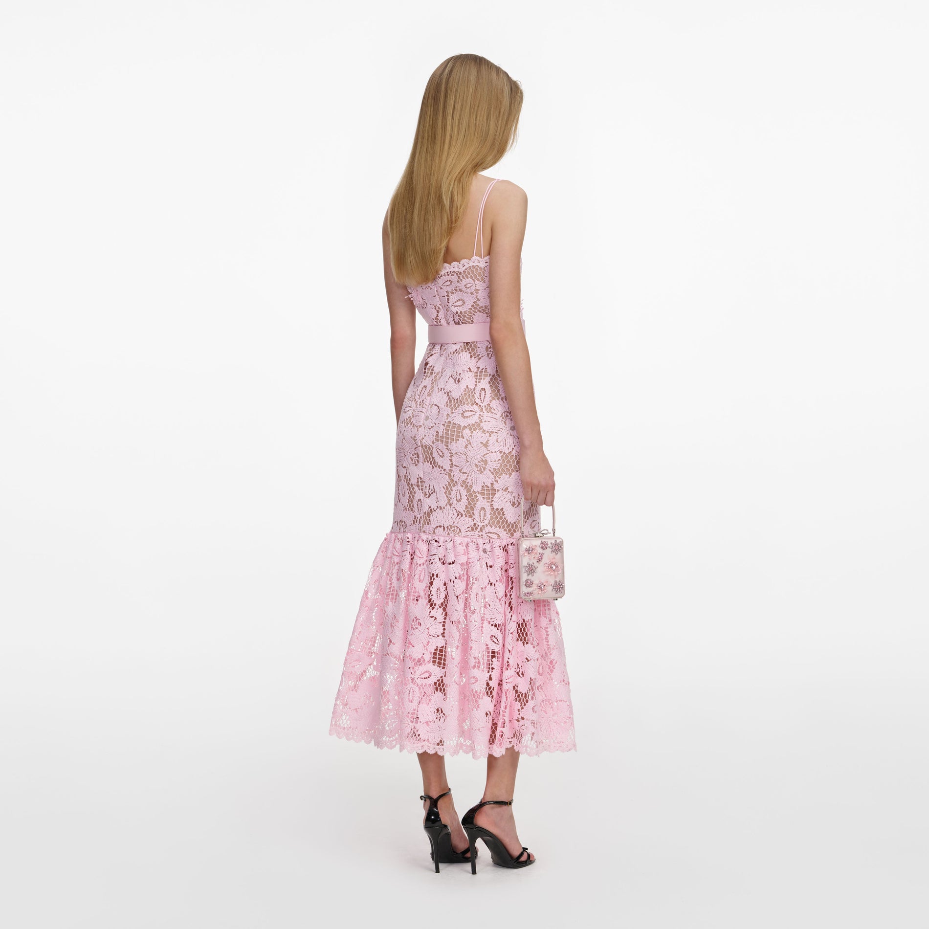 Back view of a woman wearing the Pink Crochet Lace Midi Dress