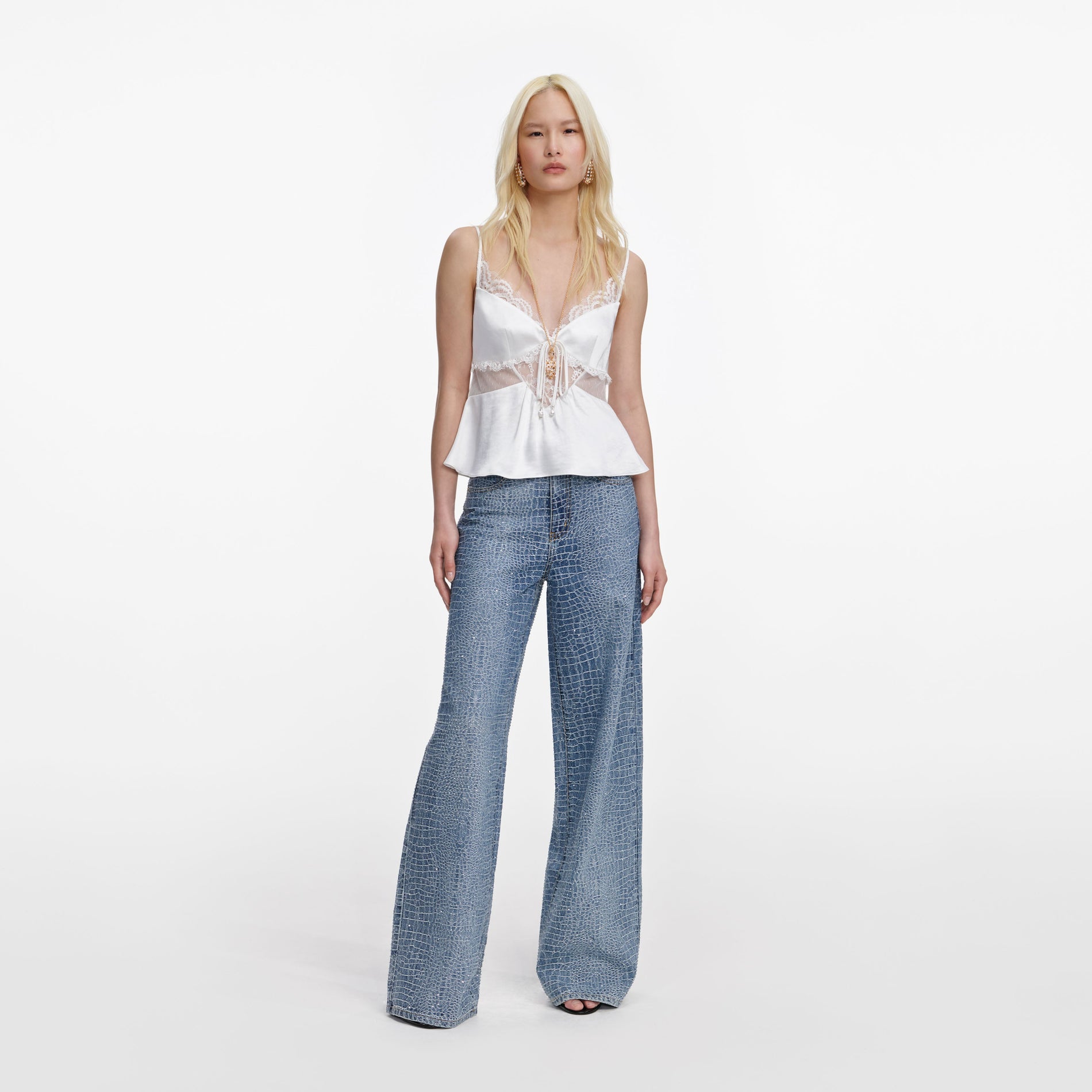 Front view of a woman wearing the White Satin Lace Top