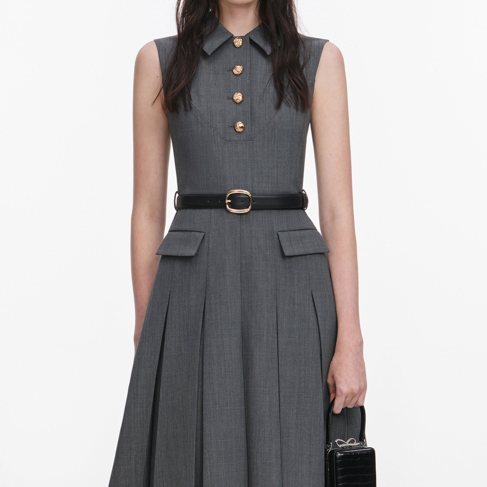 A close up of a woman wearing the Grey Tailored Pleated Midi Dress