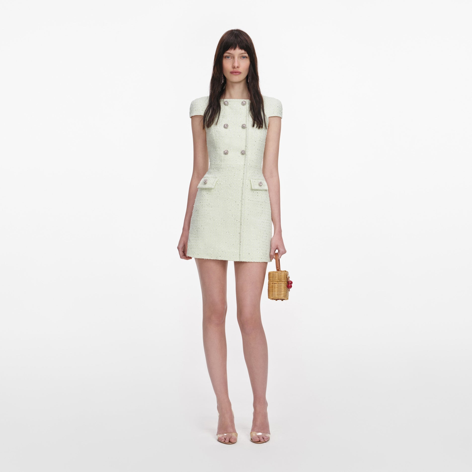 Front view of a woman wearing the Lime Boucle Mini Dress