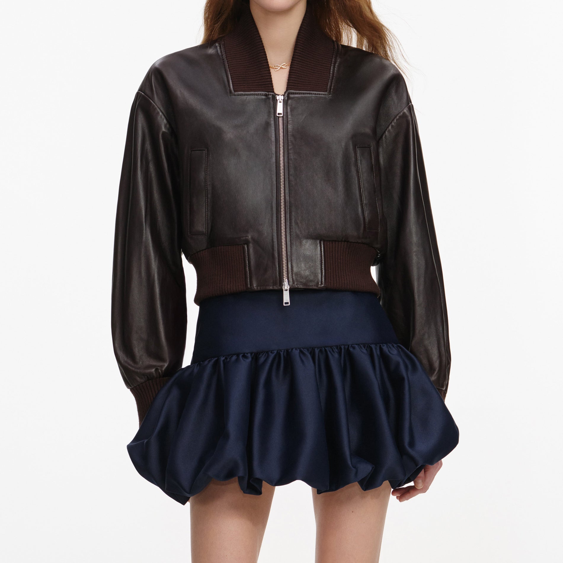 A close up of a woman wearing the Brown Leather Jacket