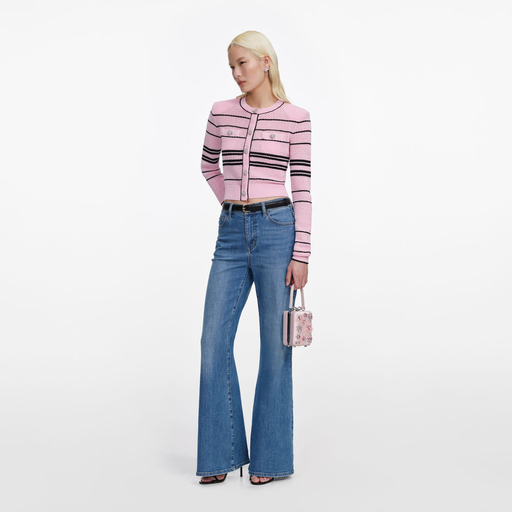 Side view of a woman wearing the Pink Stripe Cardigan