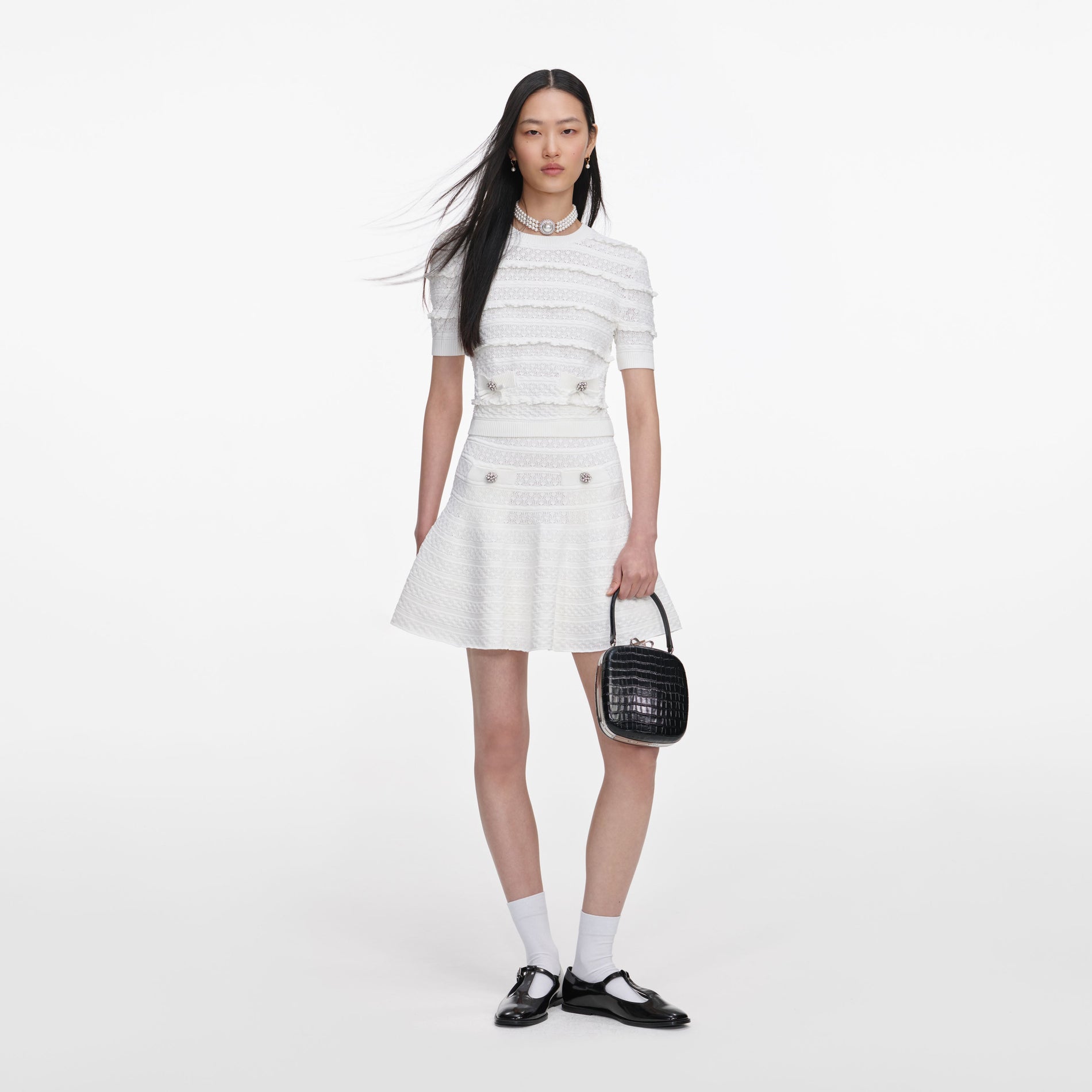 Front view of a woman wearing the White Pointelle Knit Top