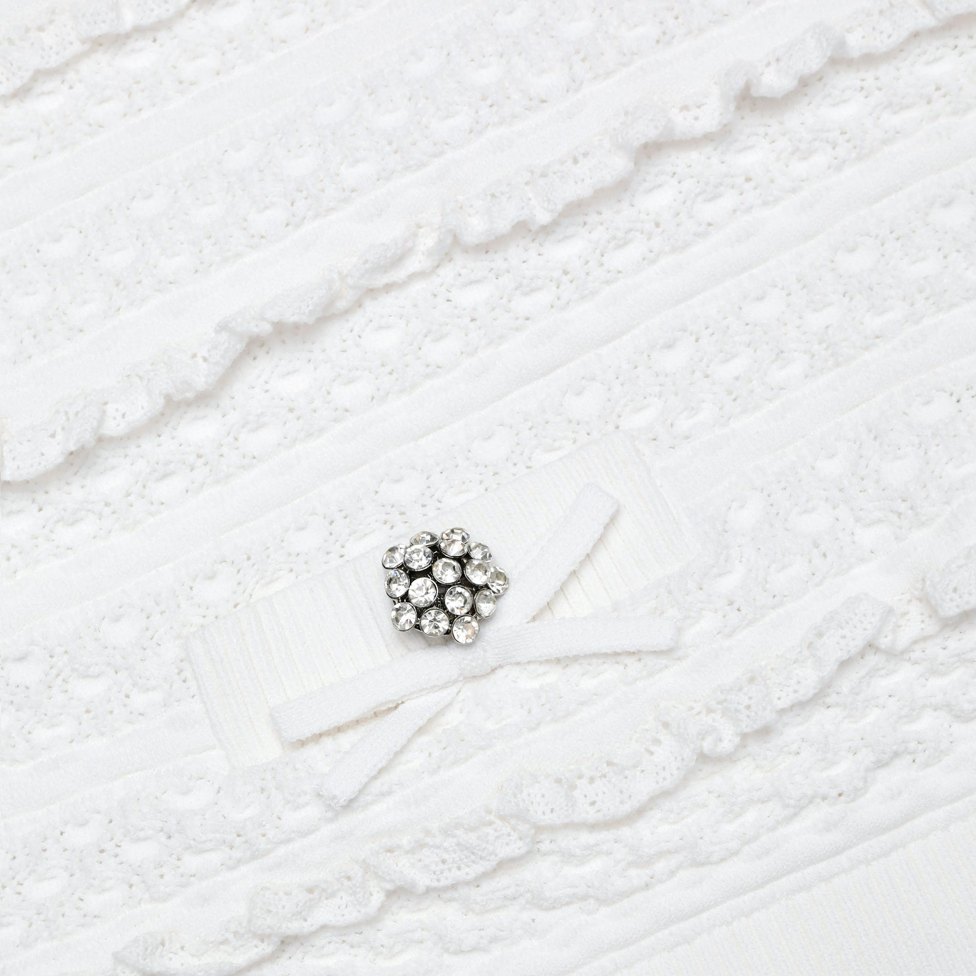 A close up of the fabric for the White Pointelle Knit Top
