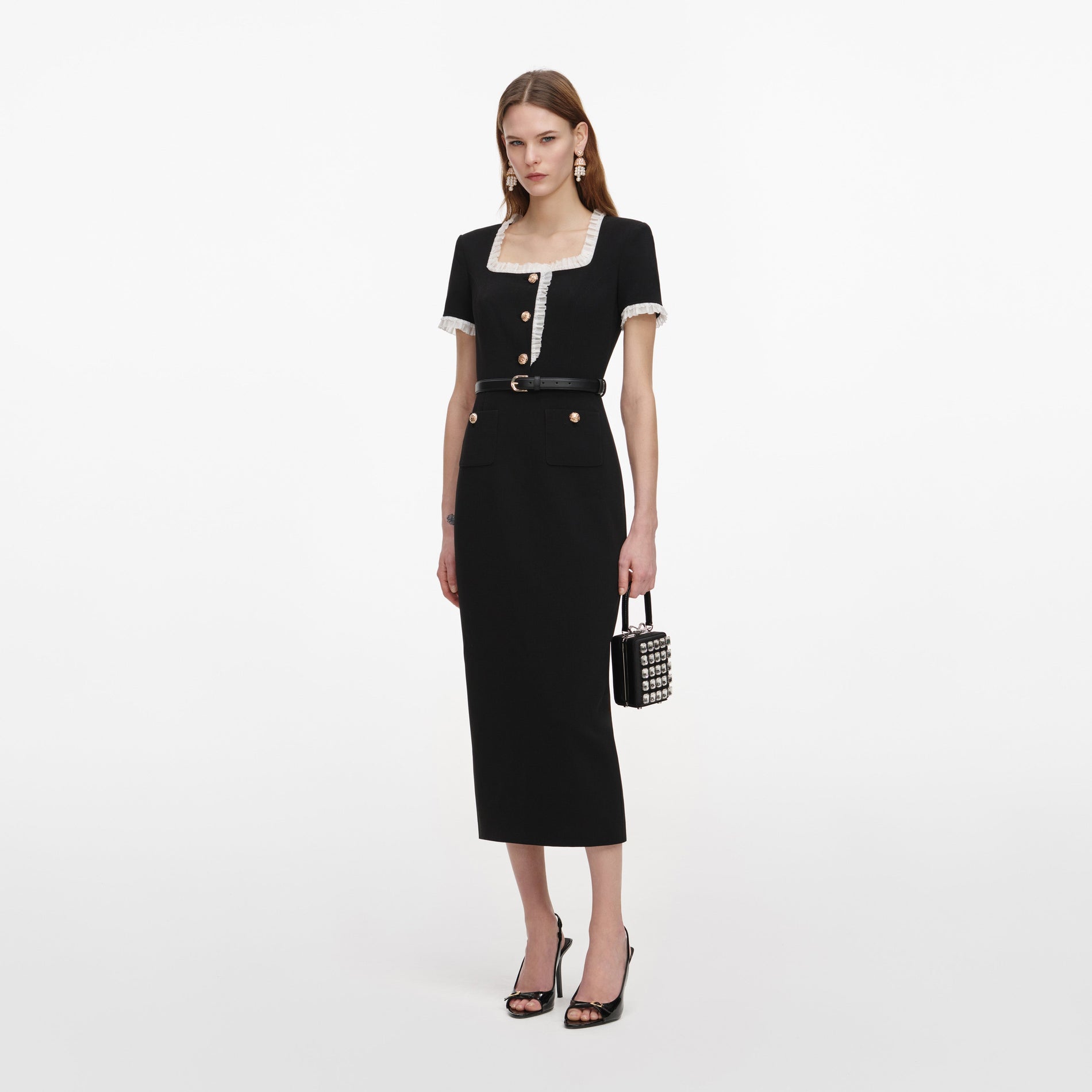 Side view of a woman wearing the Black Crepe Contrast Frill Midi Dress