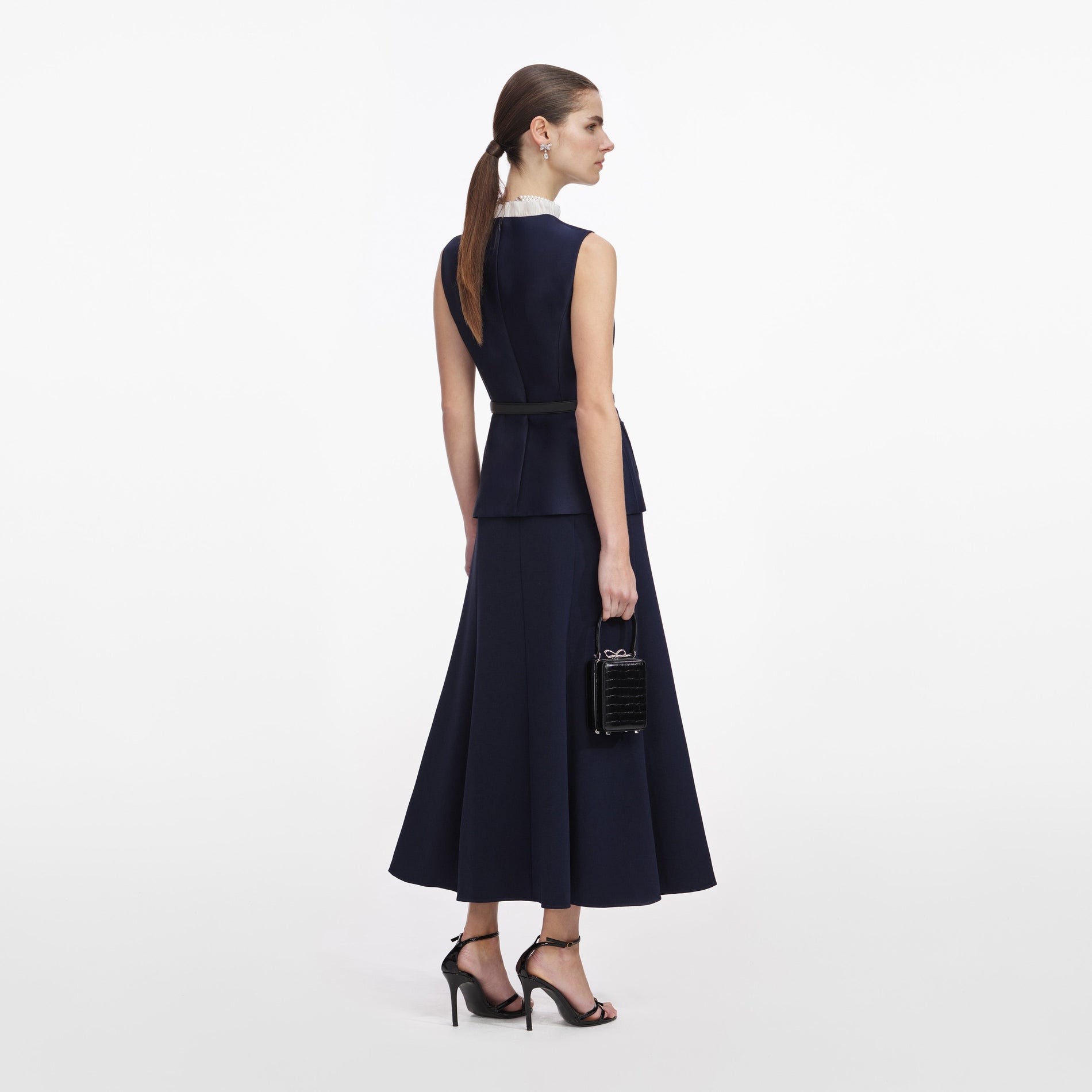 Back view of a woman wearing the Navy Taffeta Contrast Frill Midi Dress