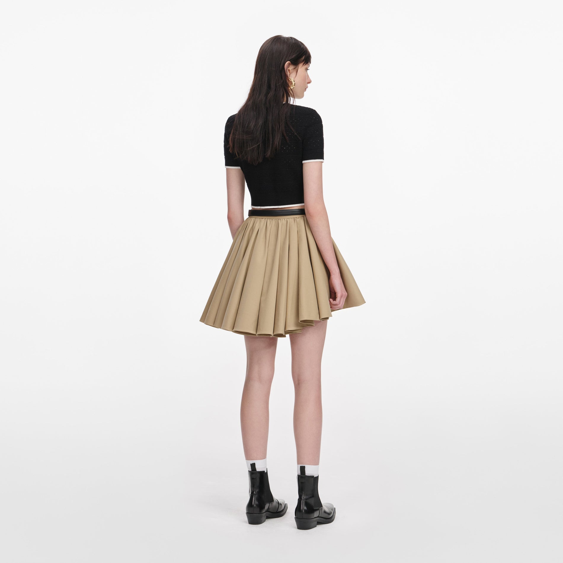 Back view of a woman wearing the Tan Cotton Mini Skirt
