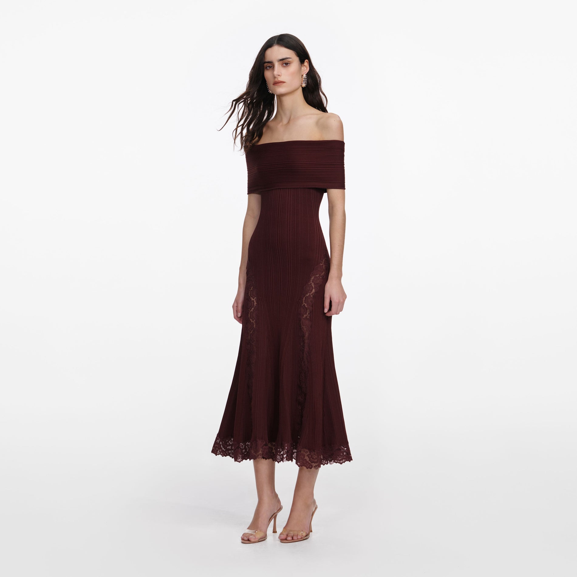 Side view of a woman wearing the Burgundy Knit Lace Insert Midi Dress