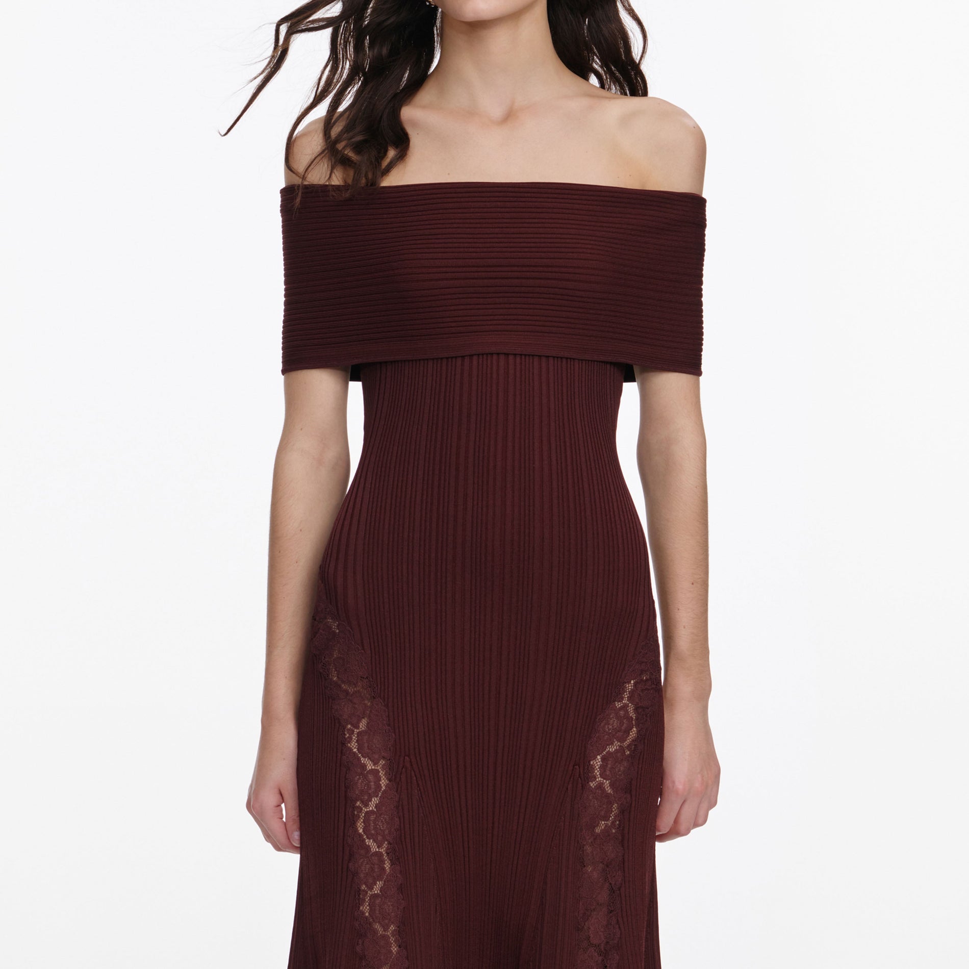 A close up of a woman wearing the Burgundy Knit Lace Insert Midi Dress