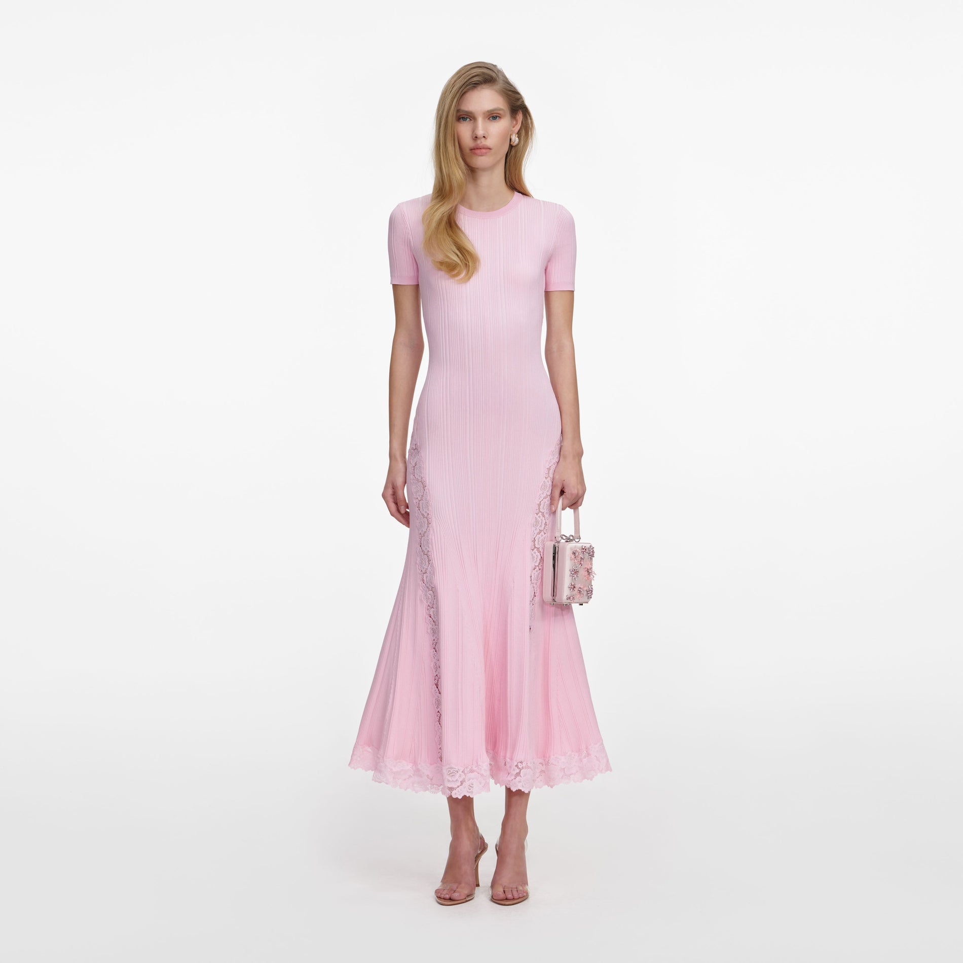 Front view of a woman wearing the Pink Knit Lace Insert Midi Dress