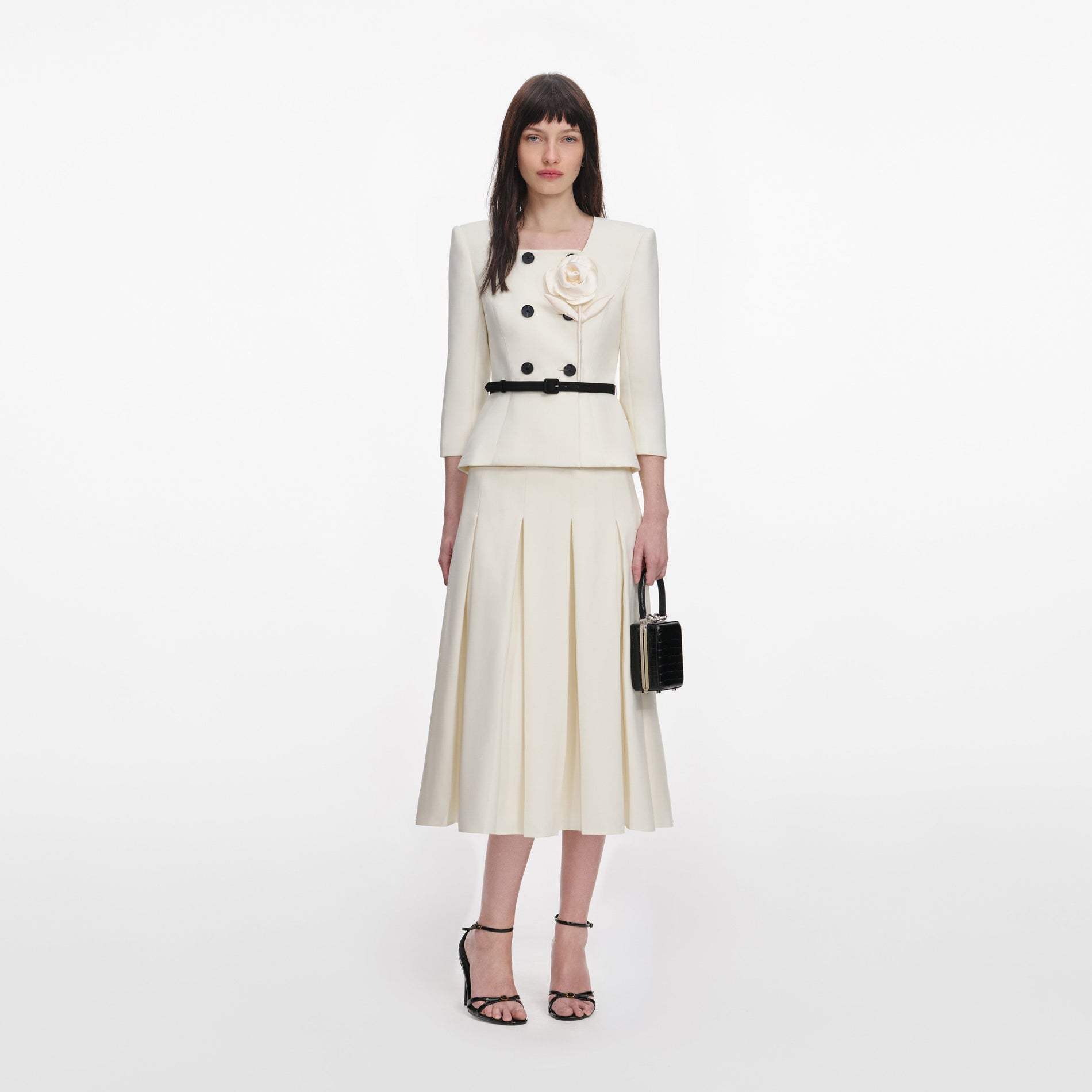 Front view of a woman wearing the Cream 3D Flower Tailored Midi Dress