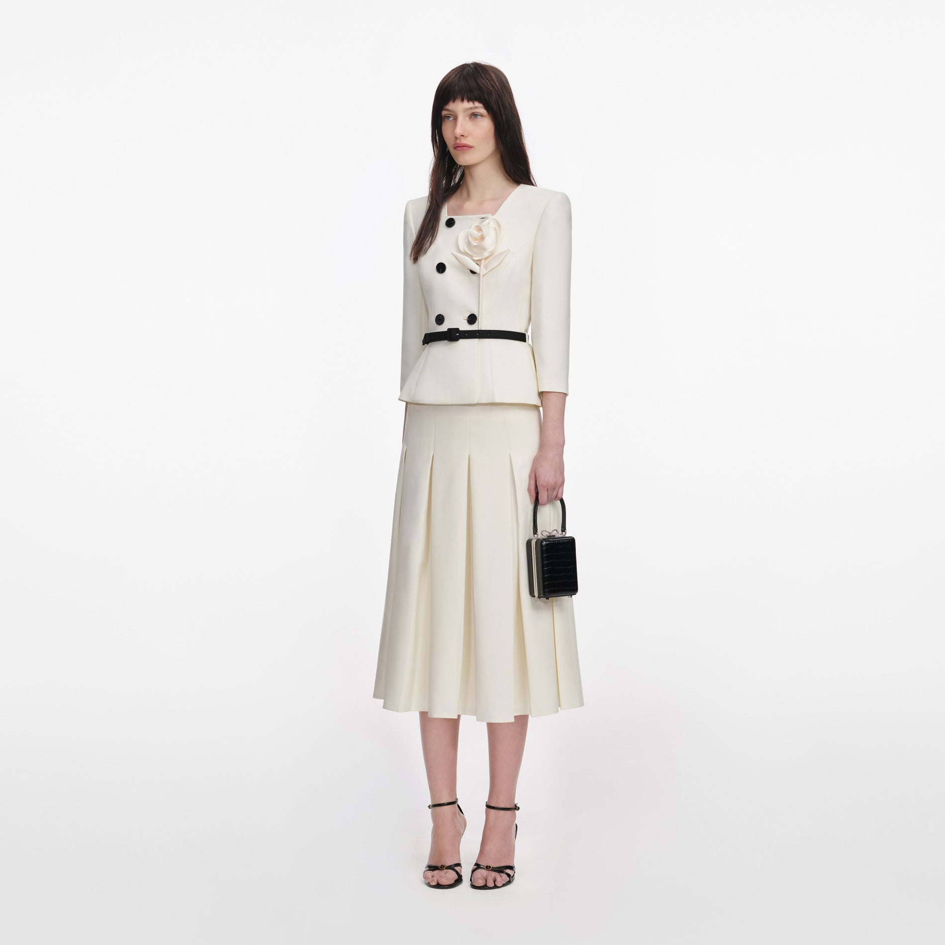 Side view of a woman wearing the Cream 3D Flower Tailored Midi Dress