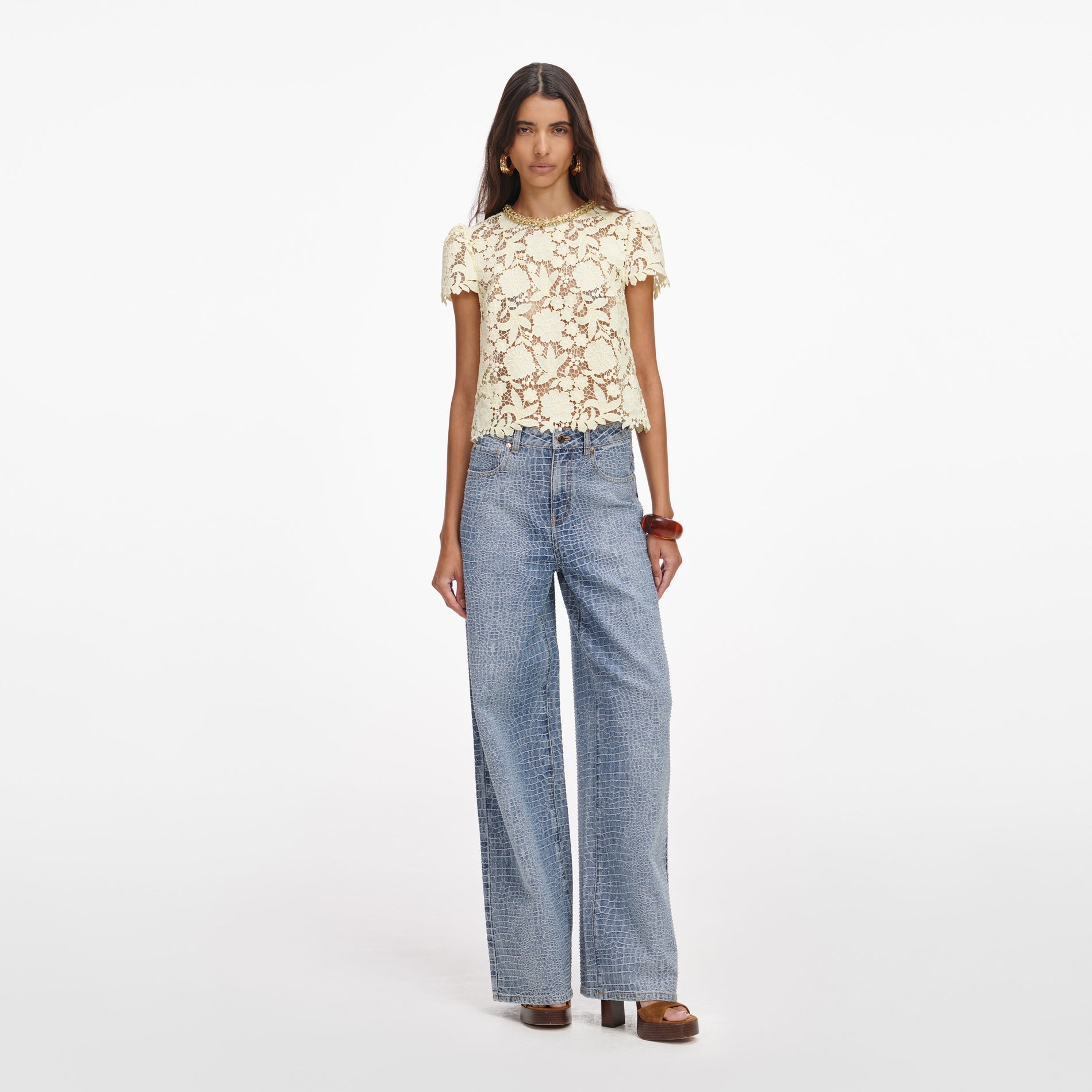 A close up of a woman wearing the Yellow Lace Top