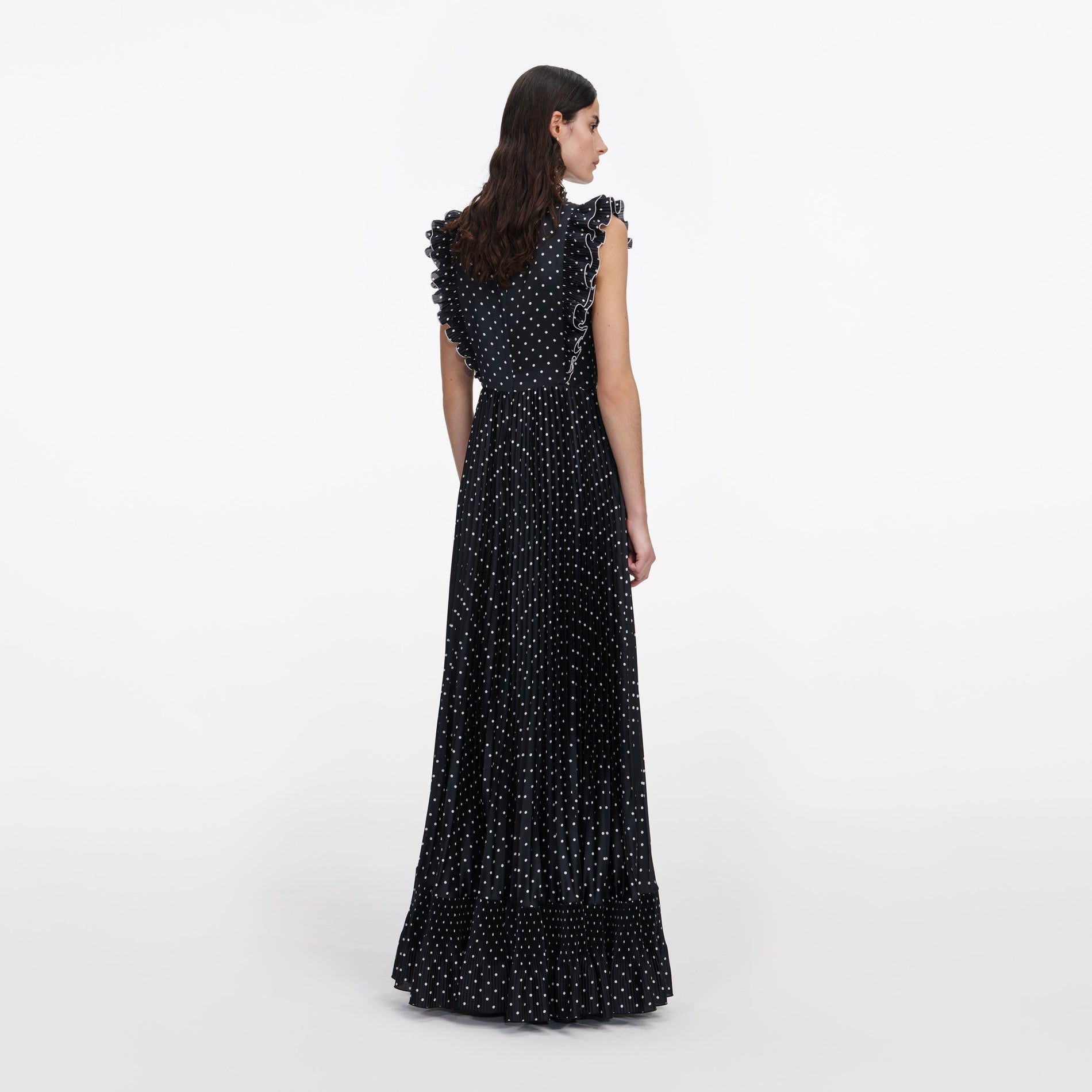 Back view of a woman wearing the Black Polka Dot Frill Maxi Dress