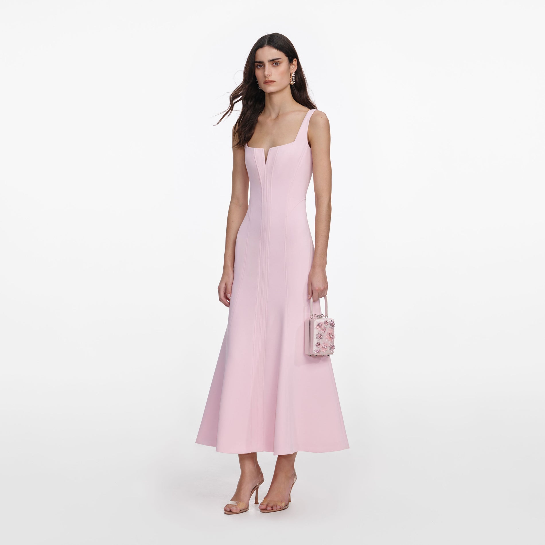 Side view of a woman wearing the Pink Crepe Midi Dress