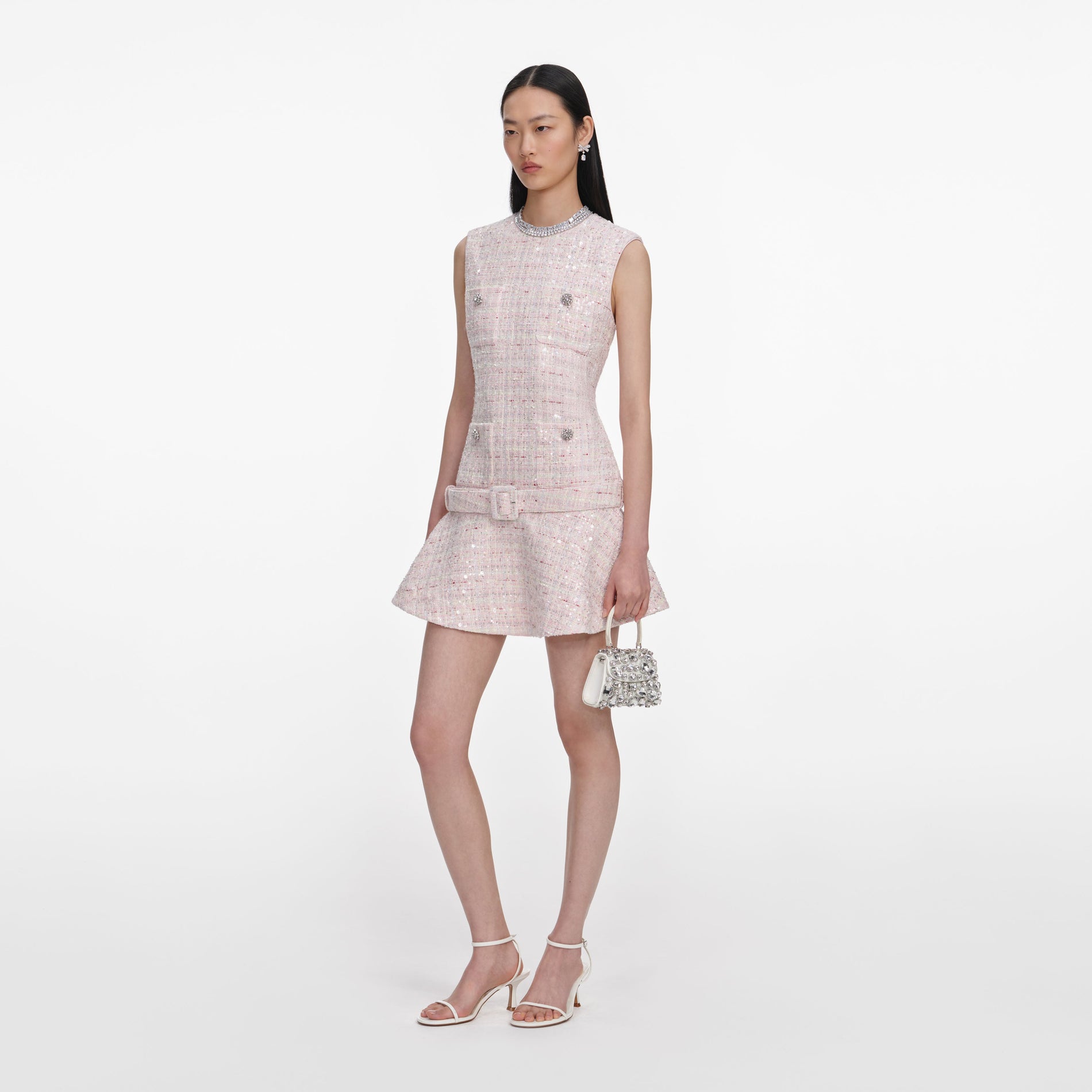 Side view of a woman wearing the Pink Sequin Boucle Belted Mini Dress