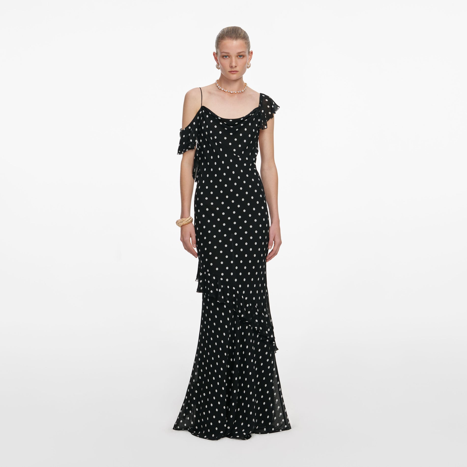 Front view of a woman wearing the Black Polka Dot Georgette Maxi Dress