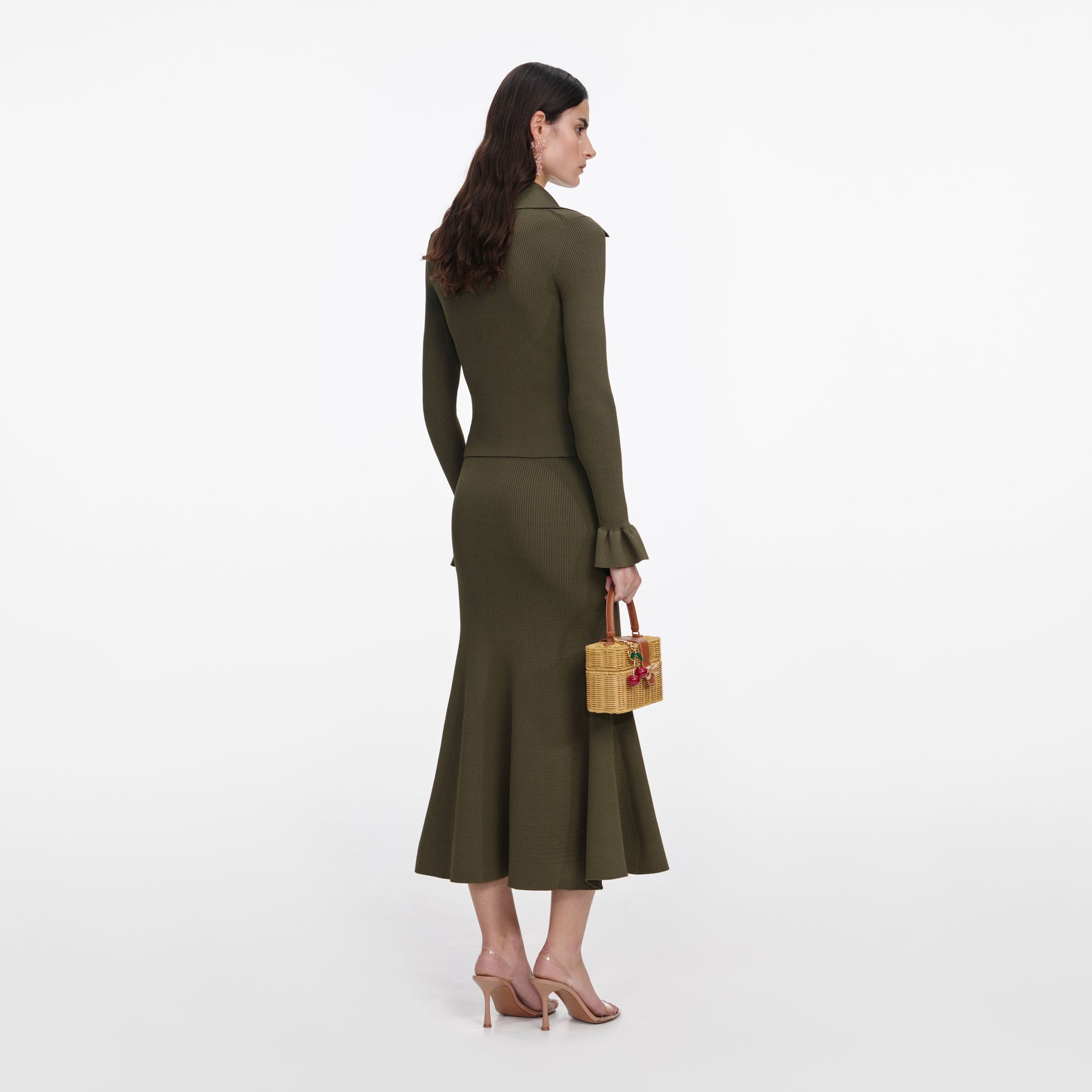 Back view of a woman wearing the Khaki Knit Midi Skirt