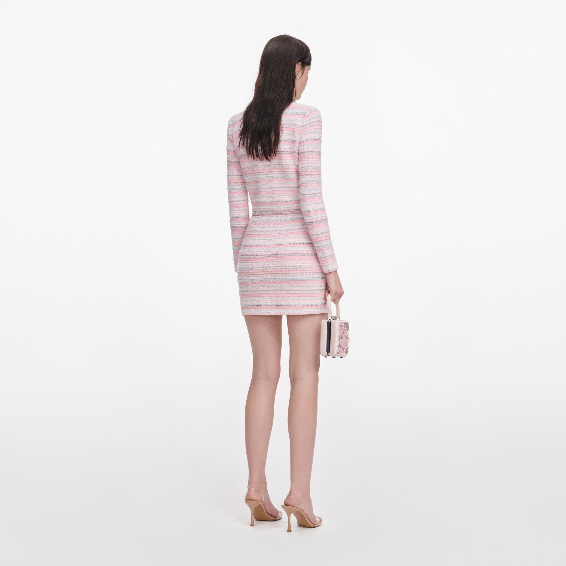 Back view of a woman wearing the Pink Textured Cardigan