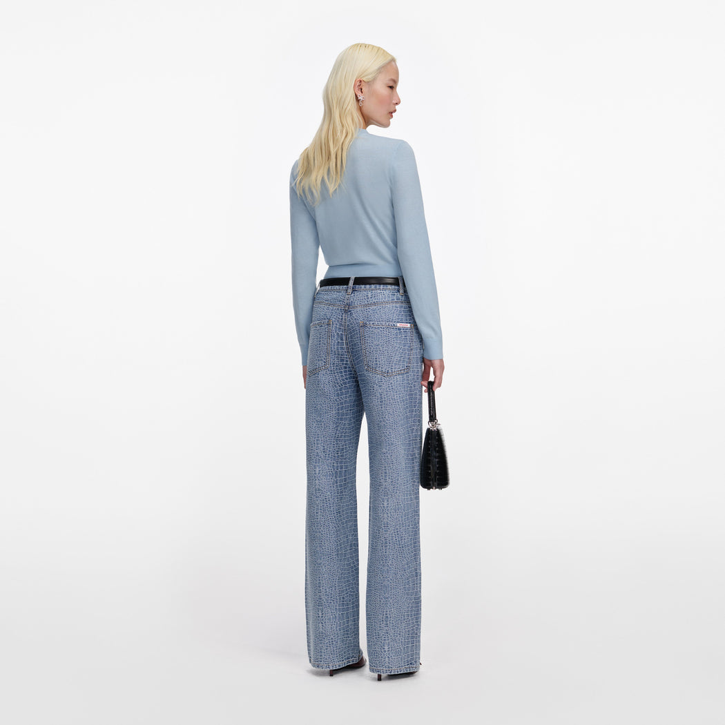 Back view of a woman wearing the Blue Rose Wool Jumper