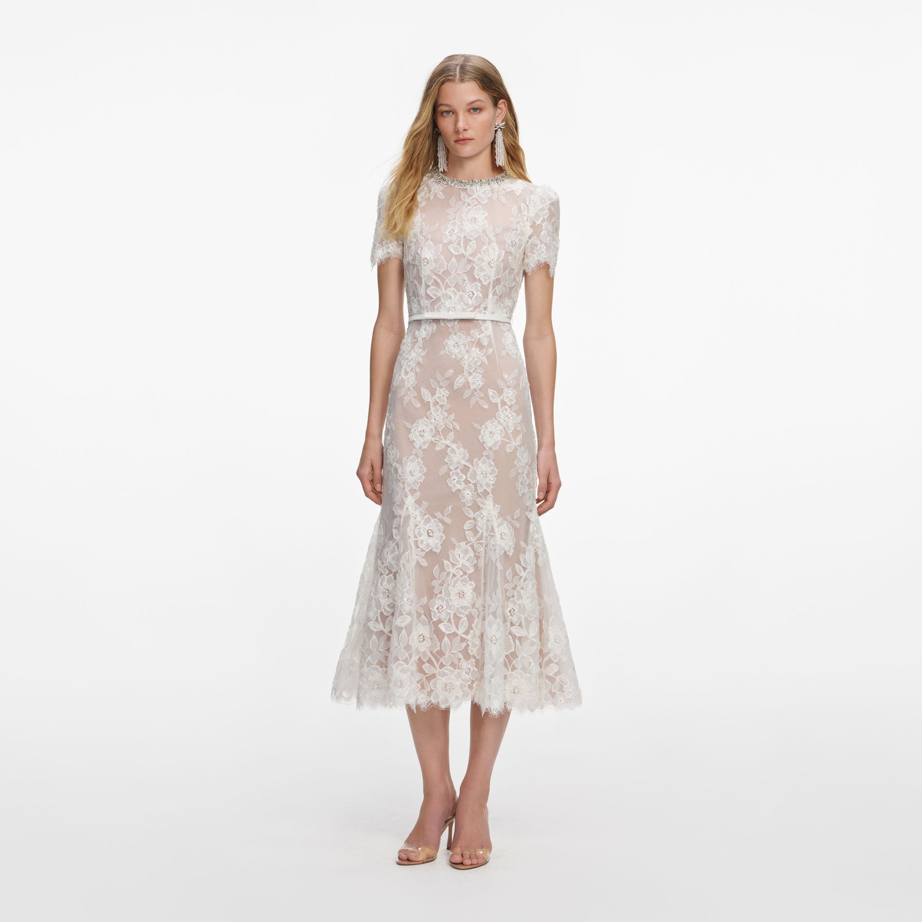 Front view of a woman wearing the White Sequin Lace Midi Dress