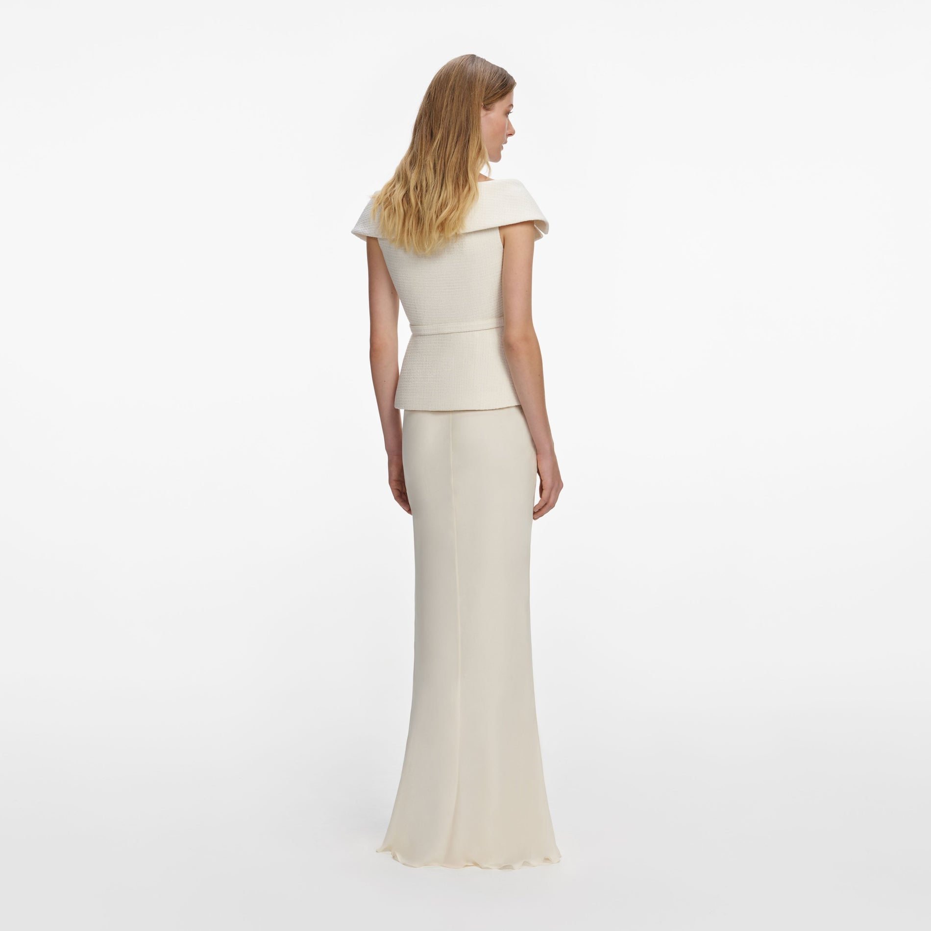 Back view of a woman wearing the Cream Boucle Maxi Dress