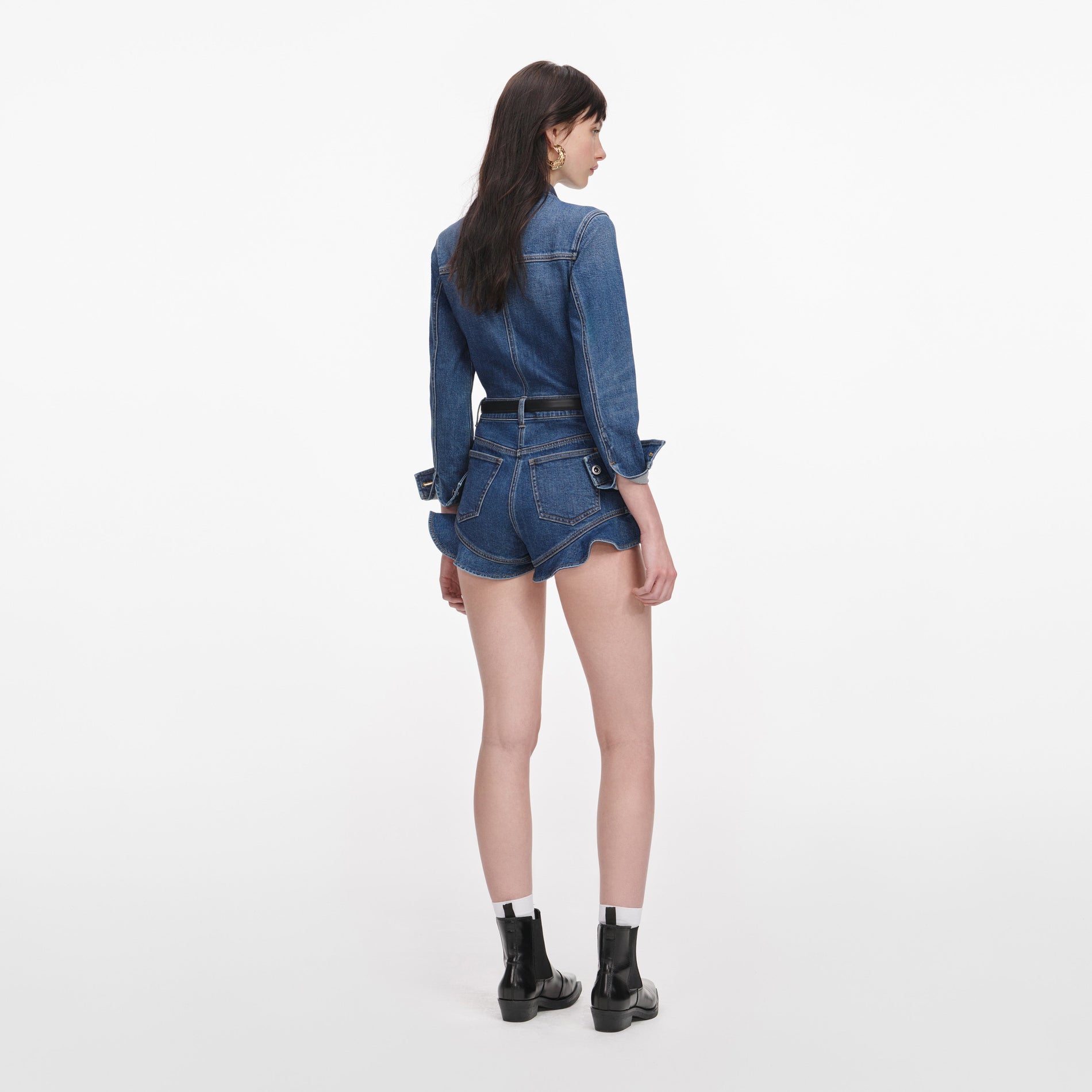 Back view of a woman wearing the Denim Frill Playsuit