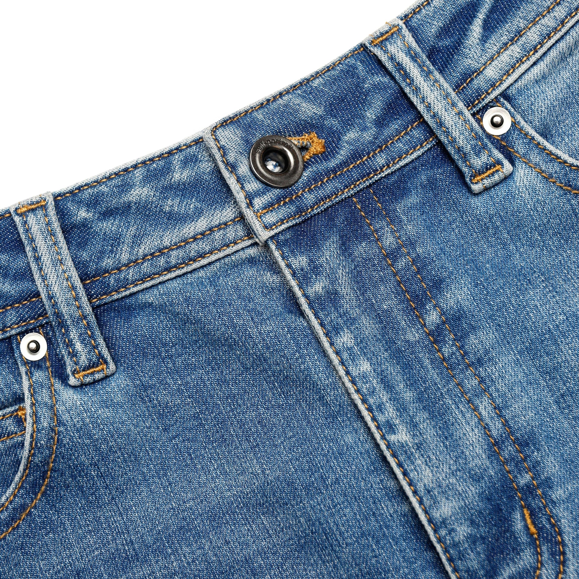 A close up of the fabric for the Mid Blue Flared Jeans