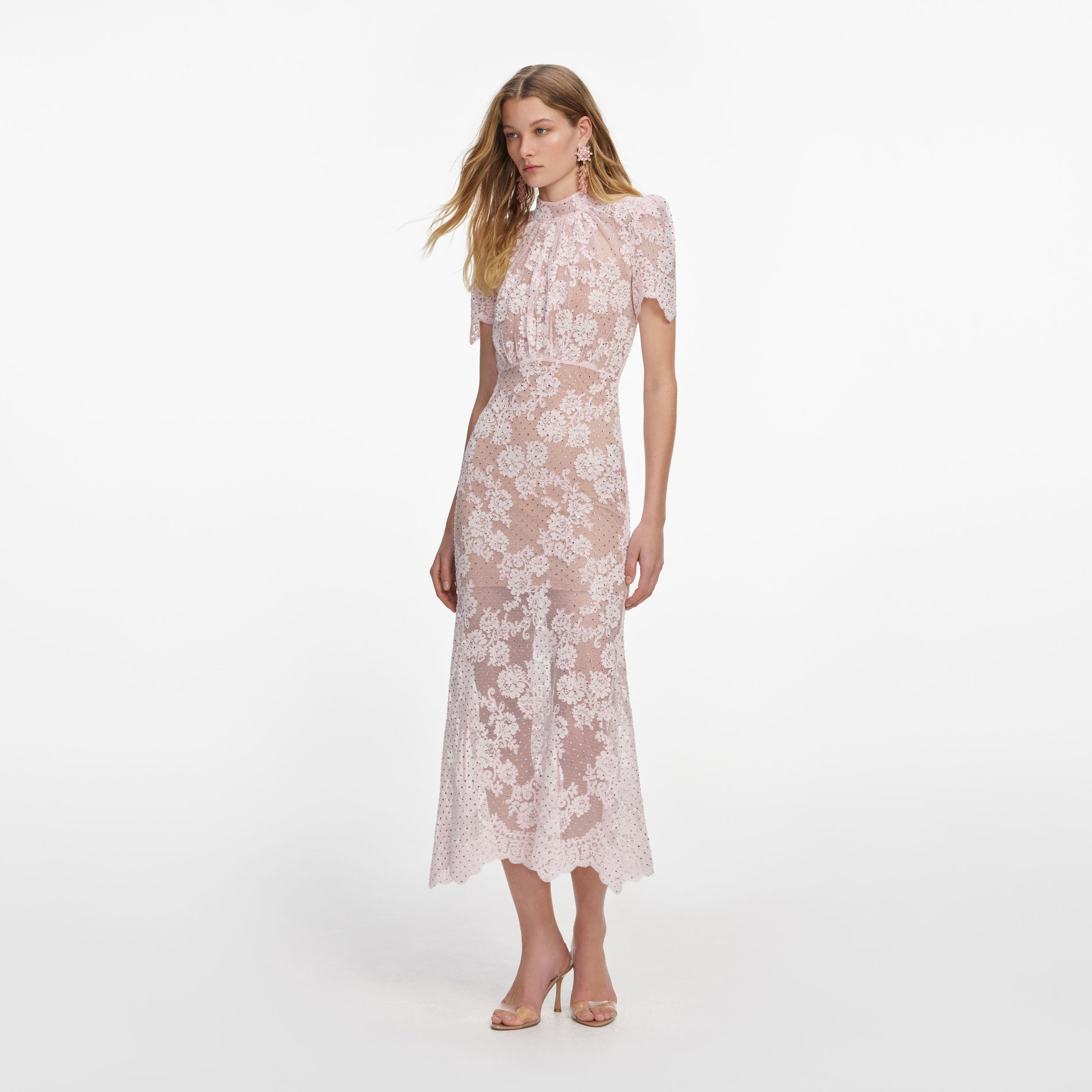 Side view of a woman wearing the Pink Rhinestone Lace Midi Dress