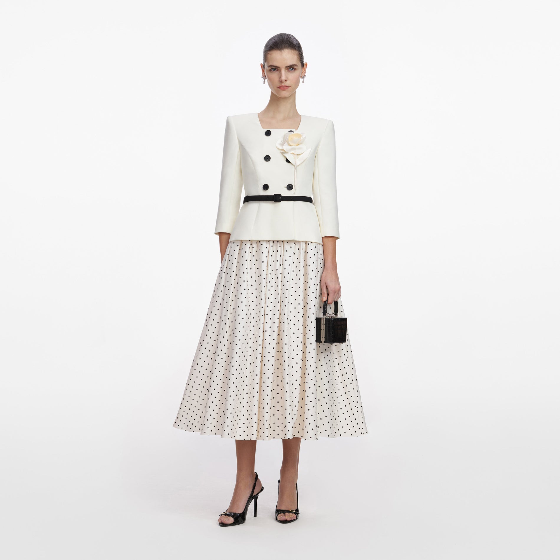 Front view of a woman wearing the Cream 3D Flower Polka Dot Midi Dress
