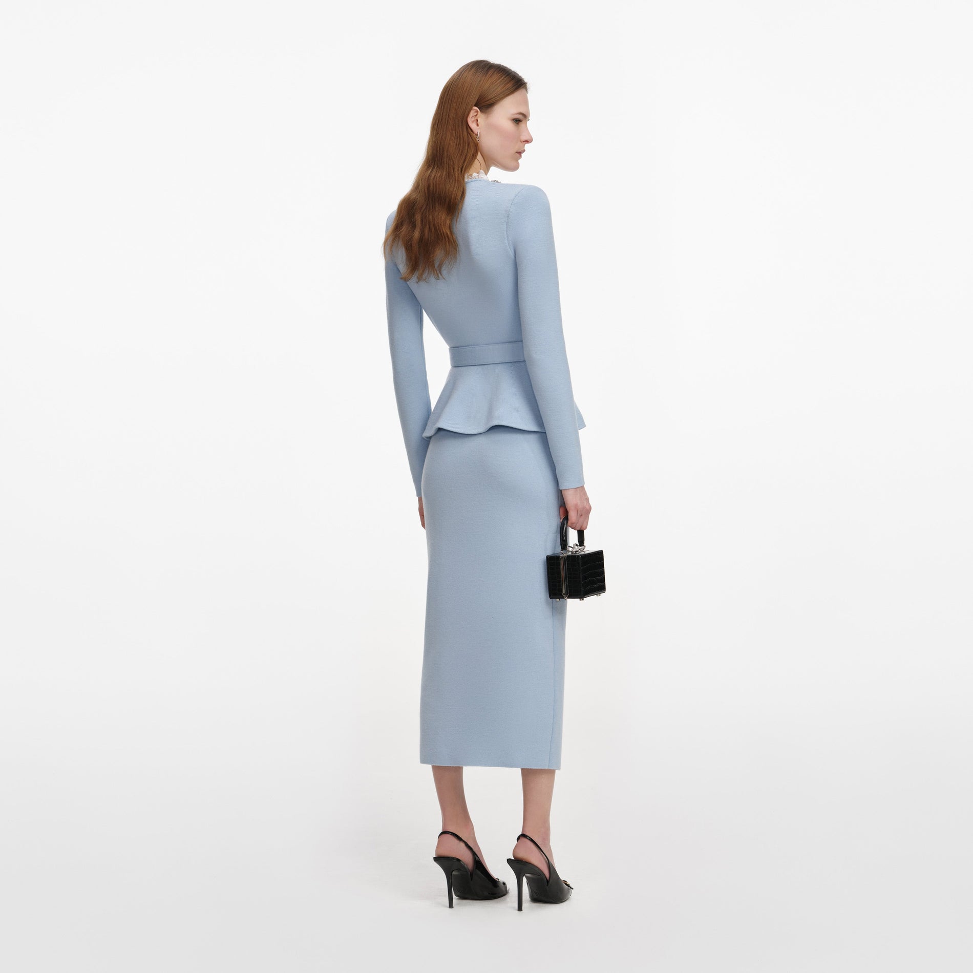 Back view of a woman wearing the Blue Crystal Trim Knit Midi Dress