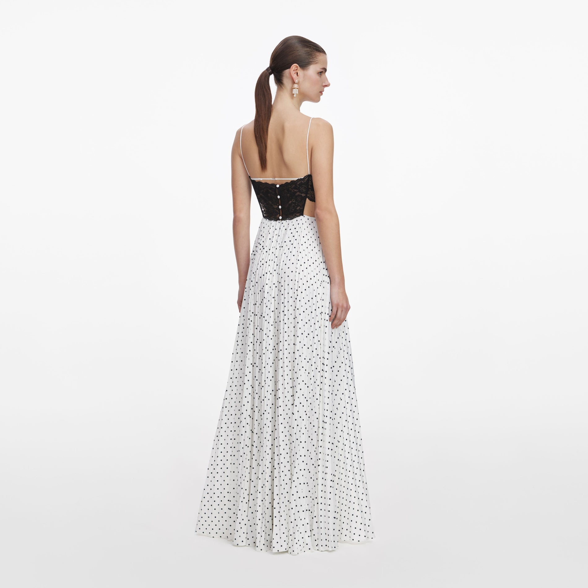 Back view of a woman wearing the White Polka Dot Satin Lace Maxi Dress