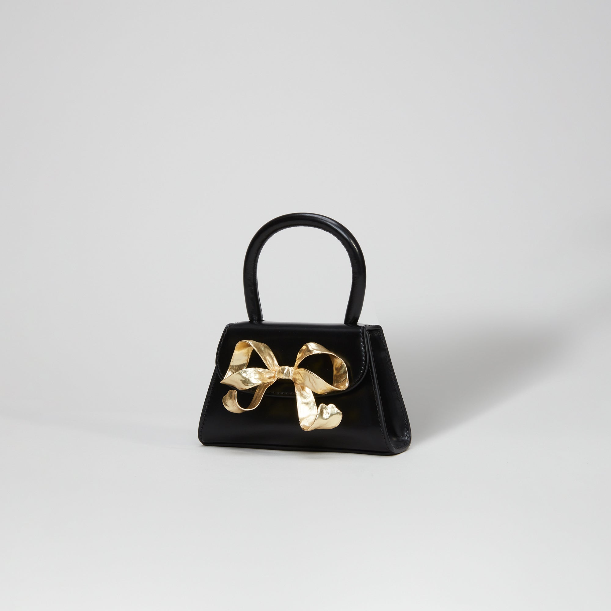 The Bow Micro in Black with Gold Hardware