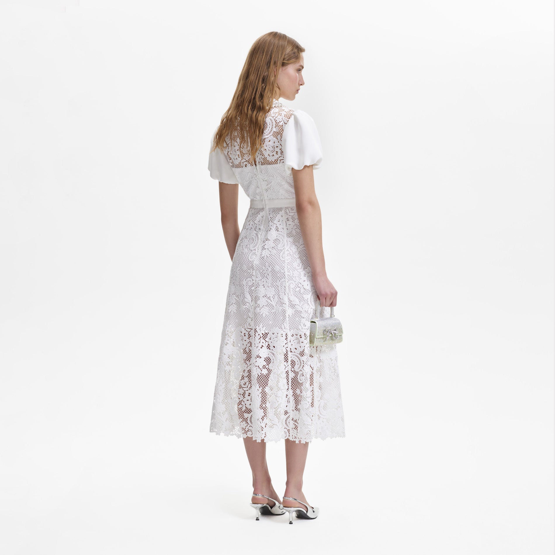 A woman wearing the White Lace Diamante Collar Midi Dress