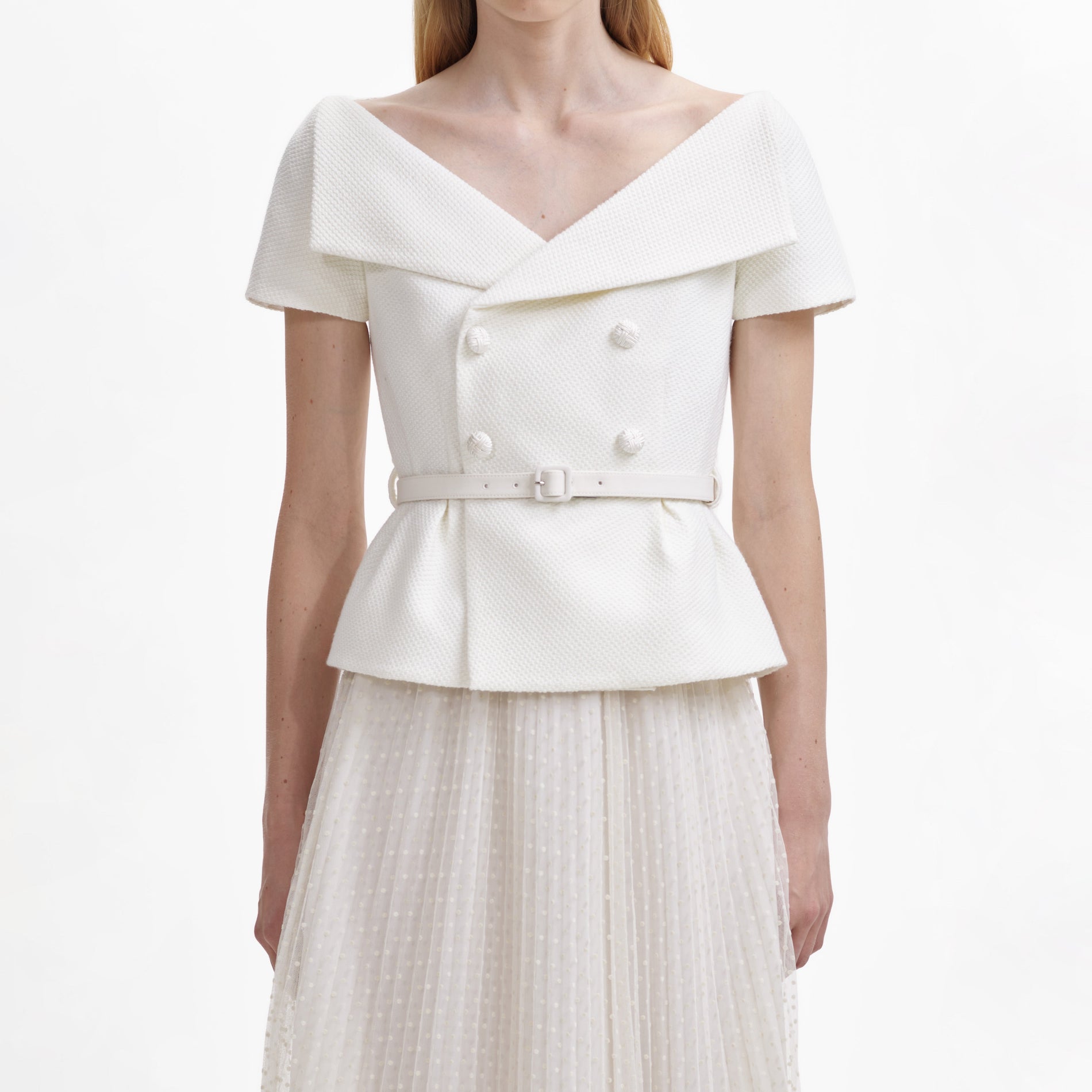 A close up of the fabric for the Cream Off Shoulder Midi Dress