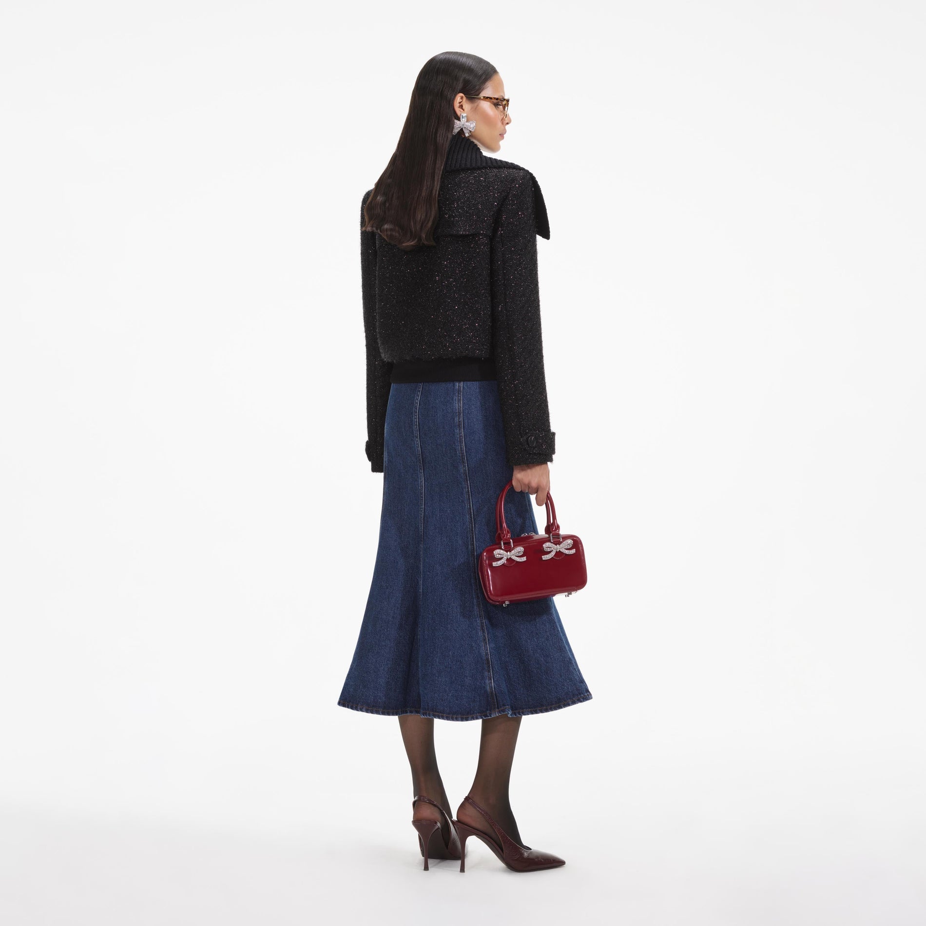 Back view of a woman wearing the White Black Tinsel Boucle Bomber Jacket