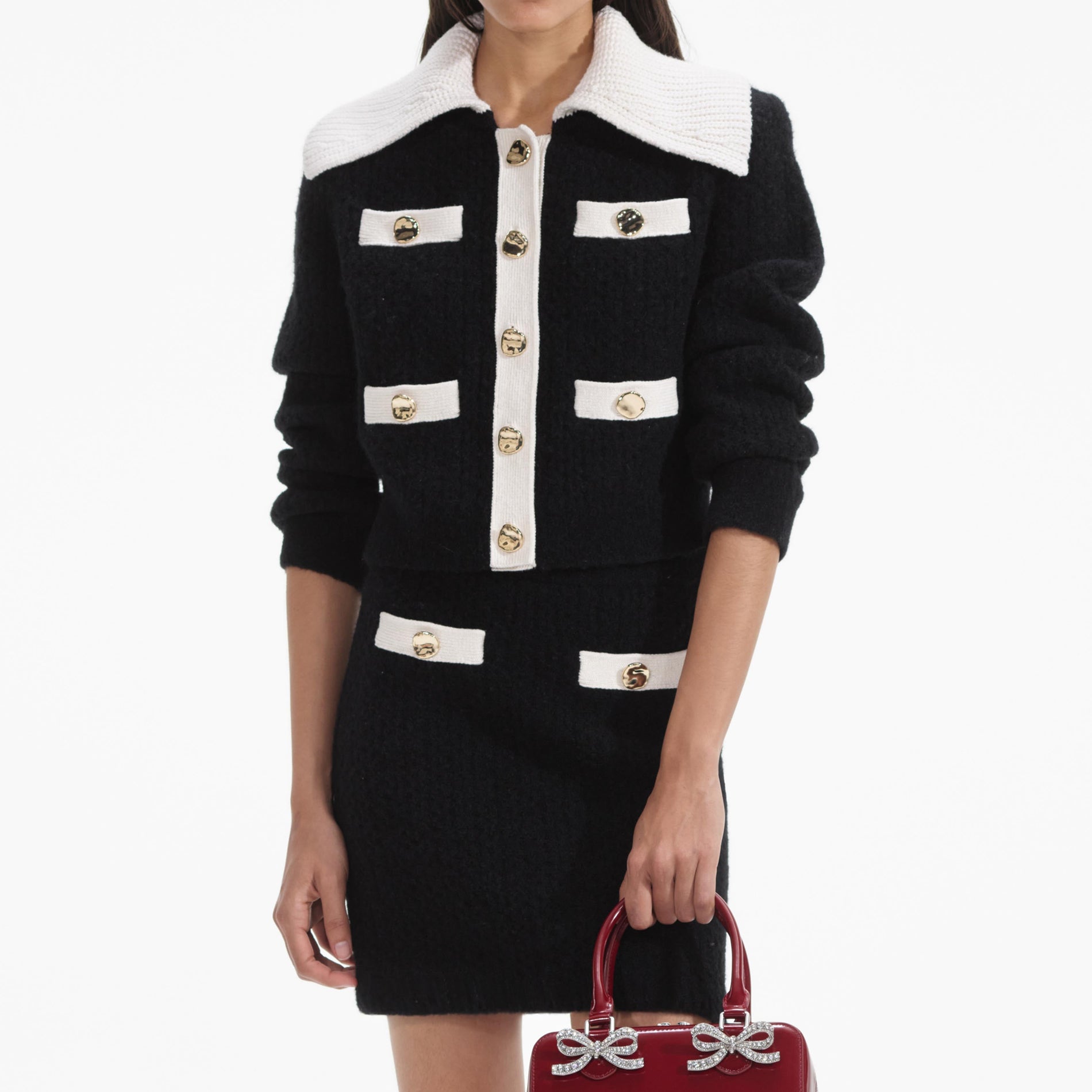 A close up of a woman wearing the Black Cashmere Blend Knit Skirt