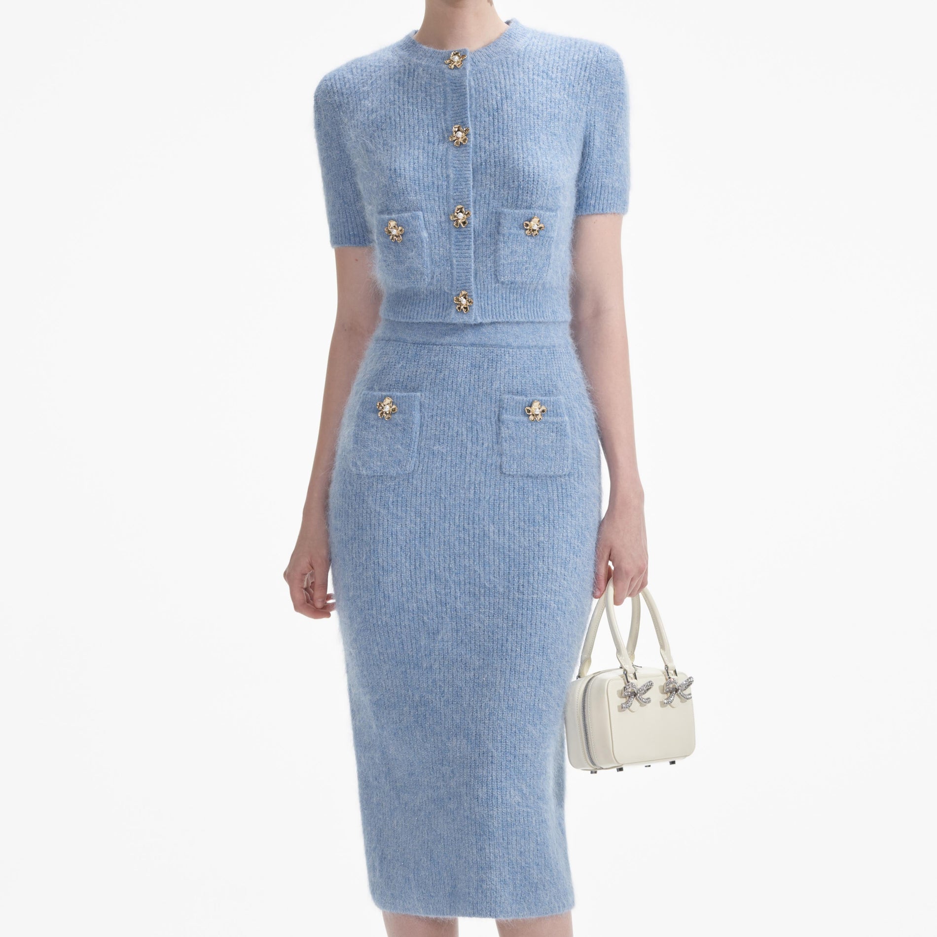 A close up of a woman wearing the Blue Soft Knit Midi Skirt