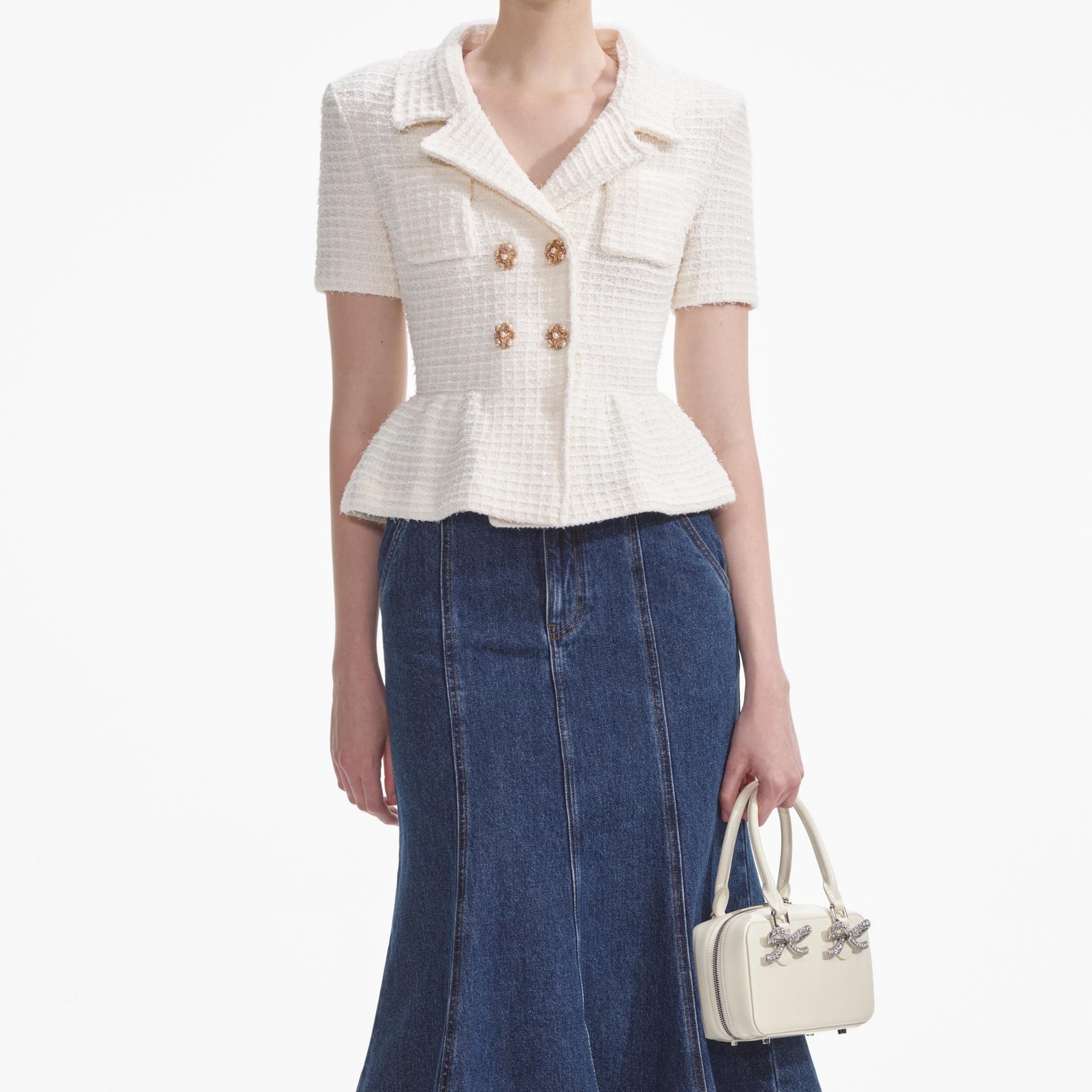 A close up of a woman wearing the Cream Textured Knit Top