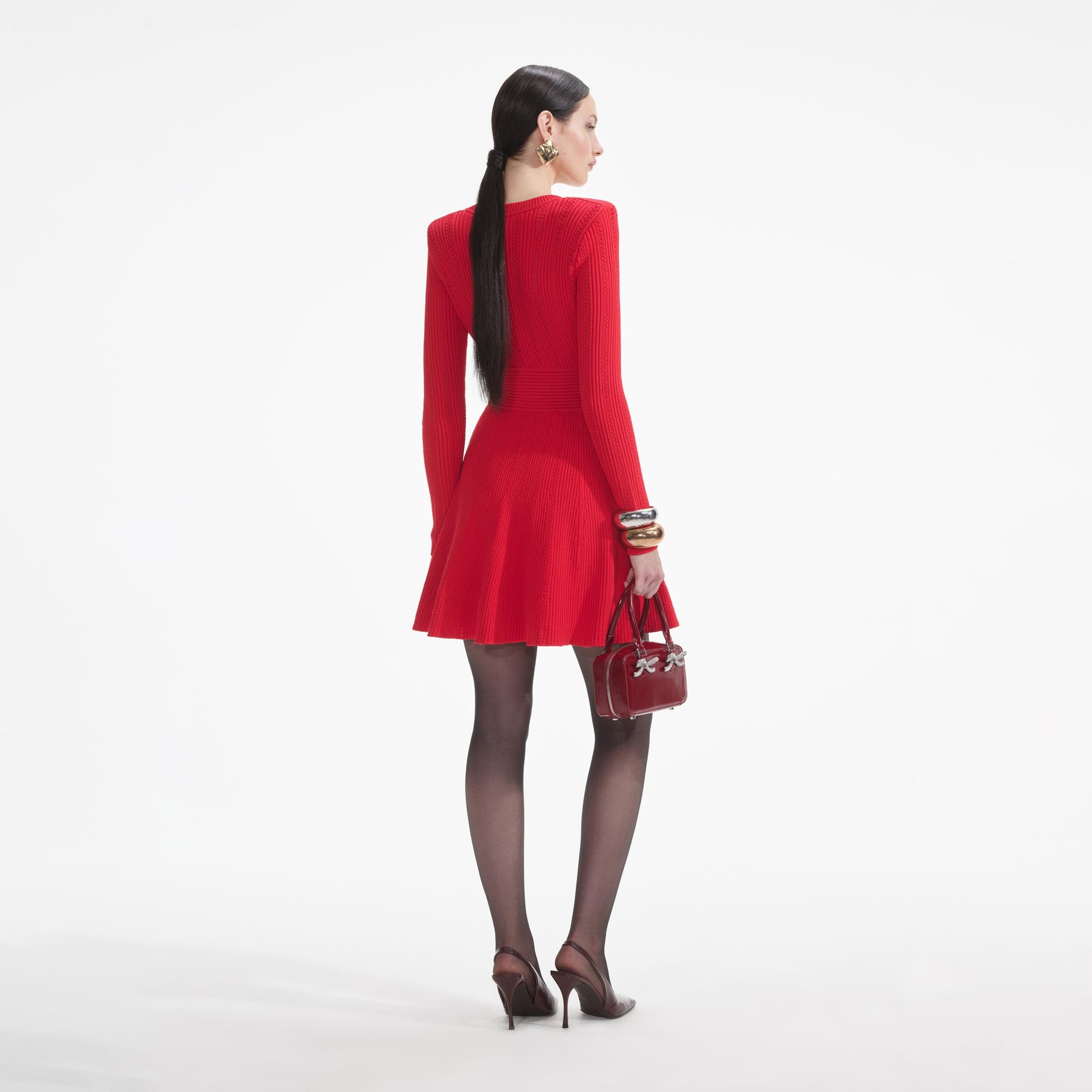 Back view of a woman wearing the White Red Pointelle Knit Mini Dress