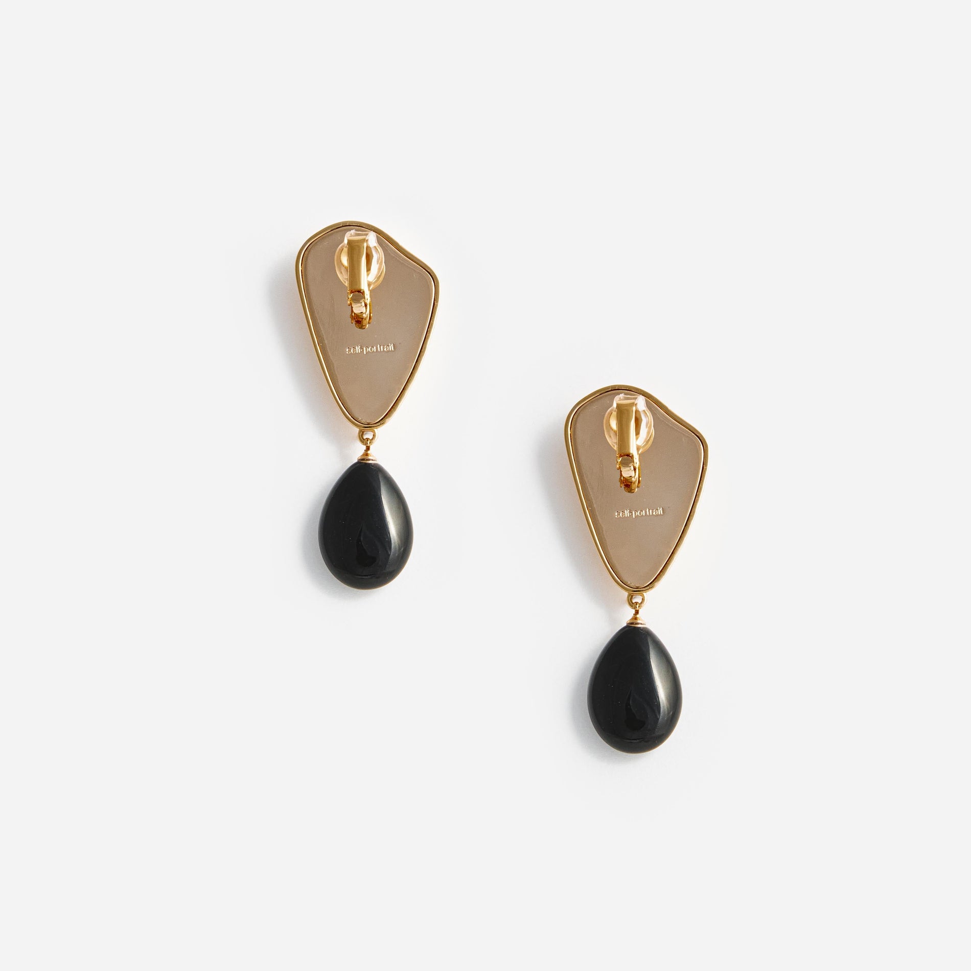 Side view of a woman wearing the Gold Droplet Earrings