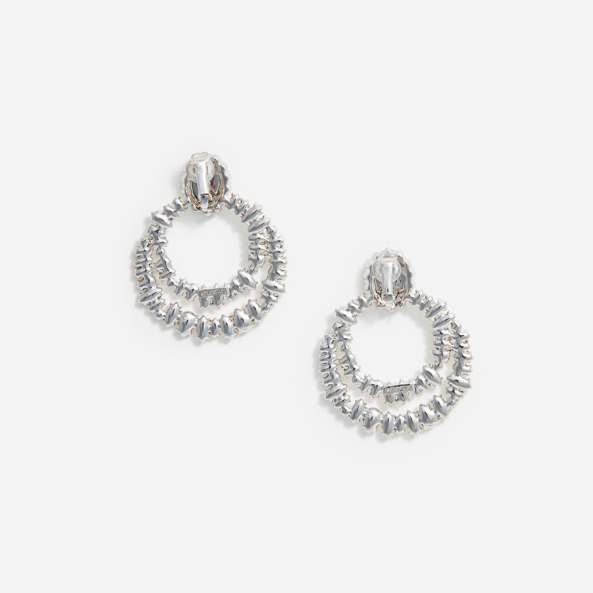 Side view of a woman wearing the Crystal Double Hoop Earrings