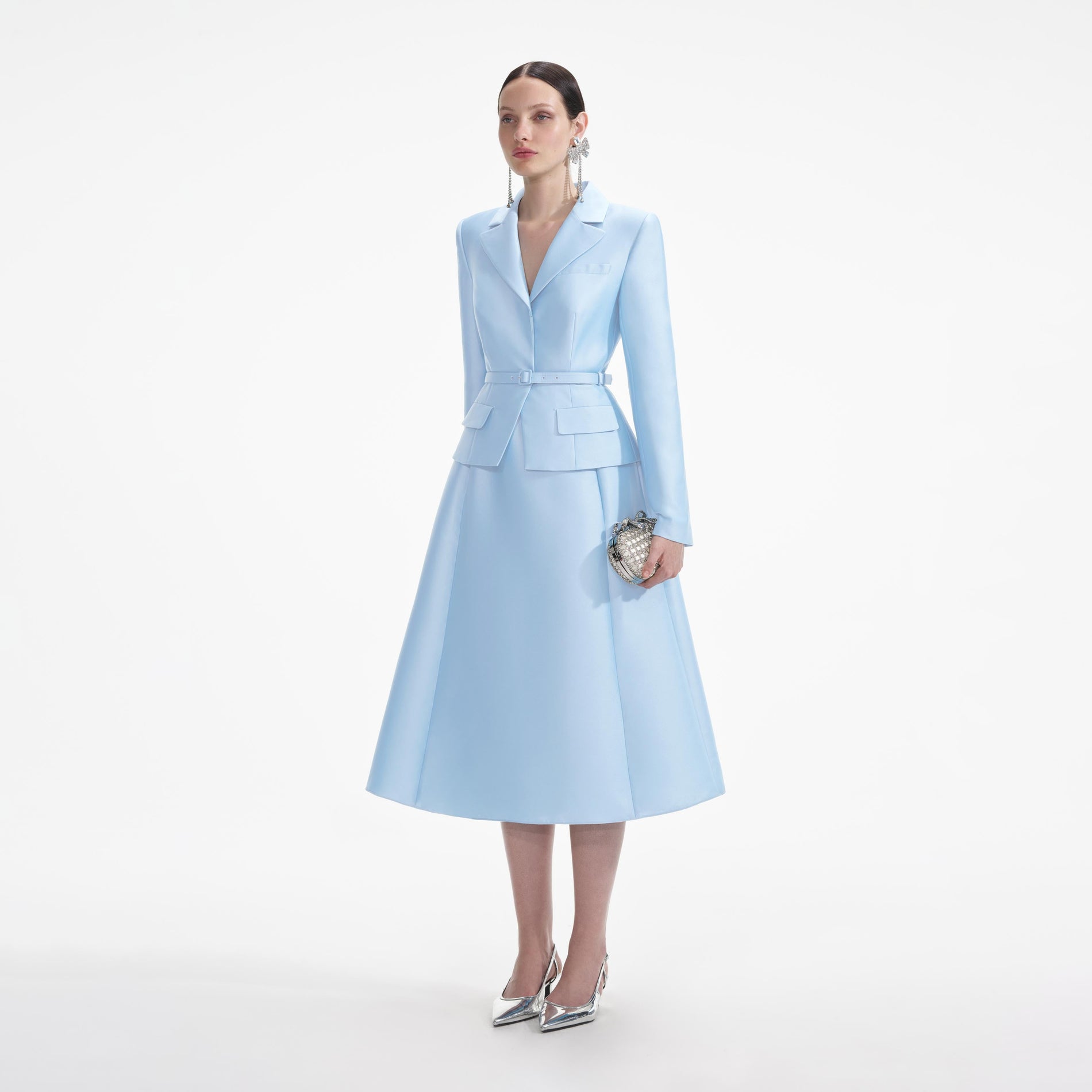 Side view of a woman wearing the Blue Tailored Taffeta Midi Dress