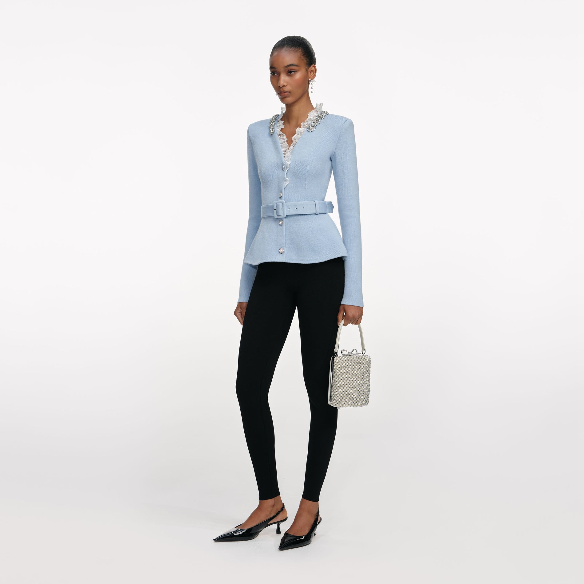 Side view of a woman wearing the Blue Crystal Trim Cardigan
