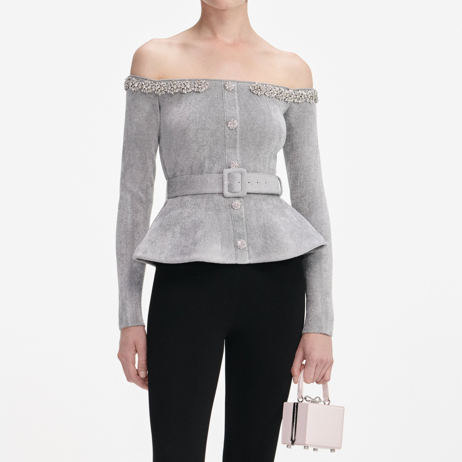 A close up of a woman wearing the Grey Chenille Knit Crystal Trim Top