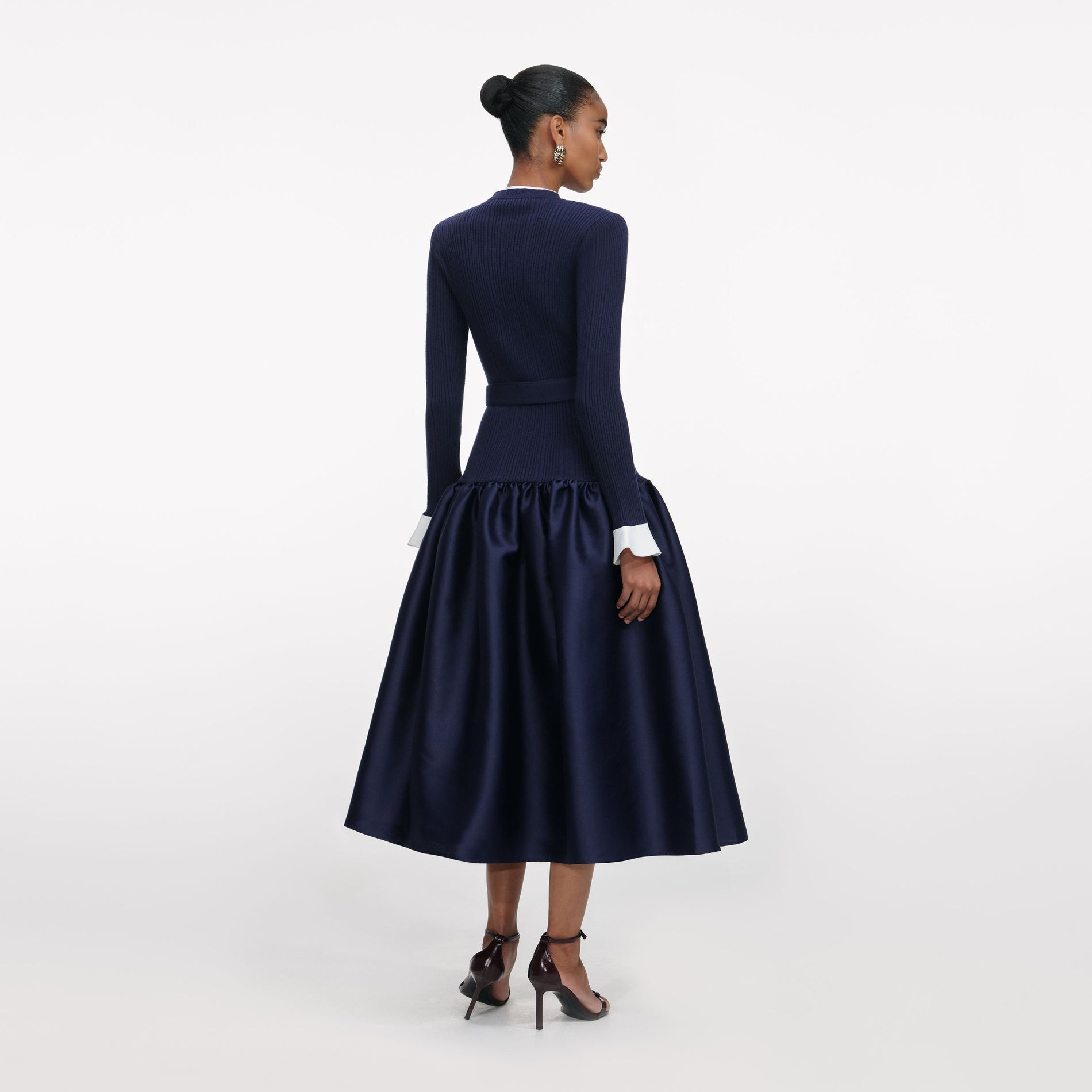 Back view of a woman wearing the Navy Knit Taffeta Midi Dress