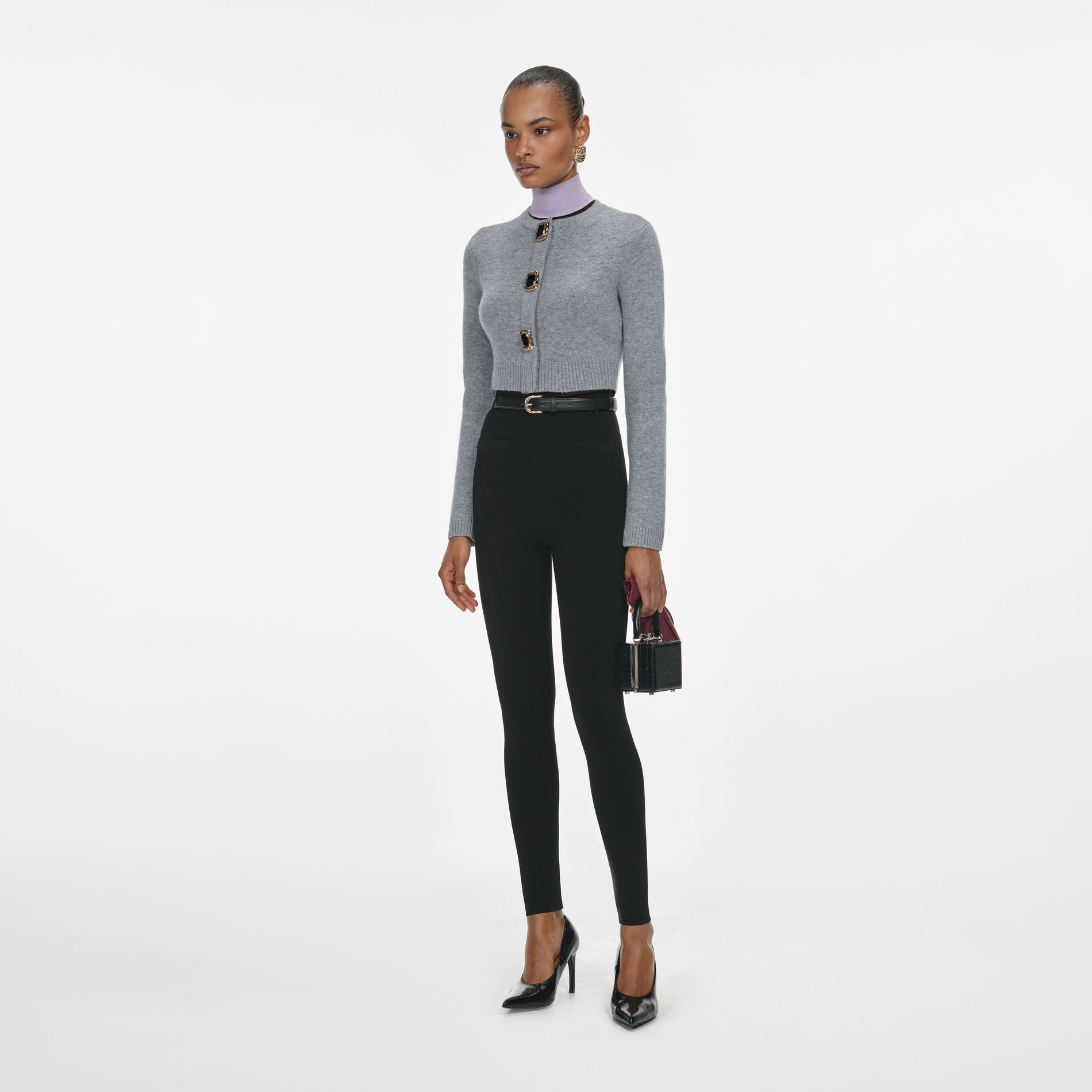 Side view of a woman wearing the Grey Wool Cardigan